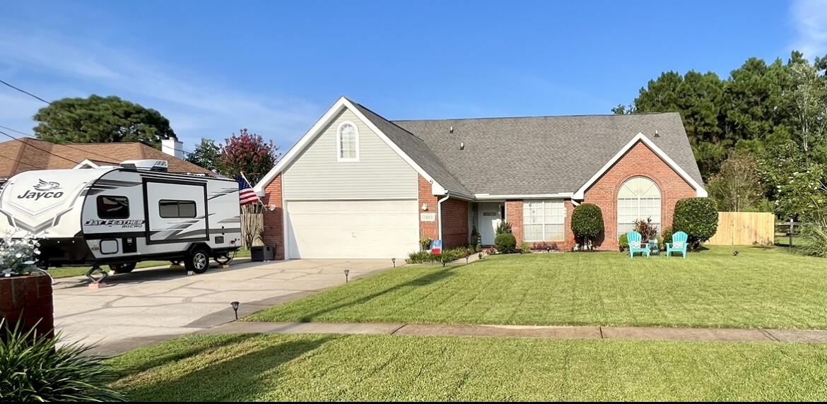 Welcome to Parish Point!Conveniently located between FWB and Navarre,this beautiful four-bedroom home has a lot of living space, a large driveway, a two car garage, and a well-kept yard with sprinkler system. The first floor includes tile flooring throughout and a large kitchen area. You'll also find the master bedroom along with a second bedroom. The living room offers a wood-burning fireplace, as well as a bonus room inside the entry that could be used as an office, playroom, or workout room. Upstairs you'll find a big loft/ open area before finding 2 more bedrooms and a full bathroom. Backyard is ready to entertain. Sturdy workshop shed that is complete with electricity and new hardy board. Come on home!