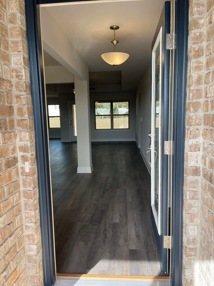 This is a 2005 Sq. Ft traditional plan with 4 bedrooms and 3 full bathrooms. This is also a split plan. Not only will you see a breakfast nook but a formal dining room as well. The kitchen island is upgraded with granite and over looks the family room.The family room opens to a covered lanai out back.The flloring throughout is with durable LVP and the bedrooms are carpeted. The master en suite shares a large walk in closet as well as dual vanities and a separate walk in shower. The exterior is 4 sided brick as well as an electric garage door opener. The property is fully sodded and landscaped with auto timed sprinklers. This home is nestled in the welcoming new sub of Silvercrest. Crestview offers ample shopping and dining and the hospital and schools just minutes away.