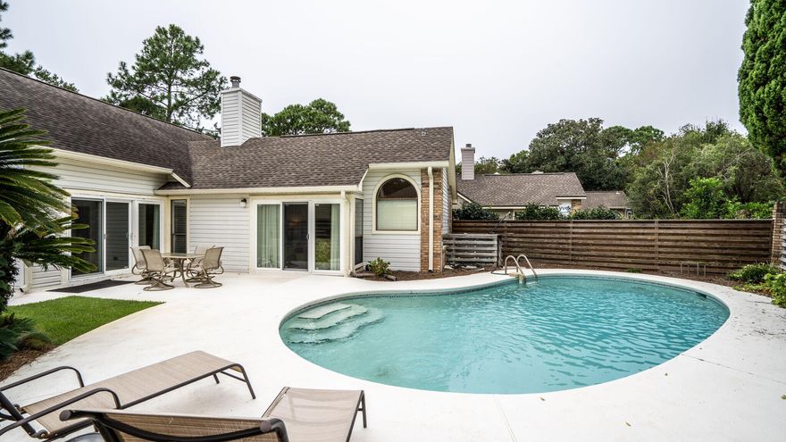 This wonderful  one level home, with a two car garage is located in a rental restricted neighborhood.  It has a large backyard and  a wonderful POOL for outdoor fun and entertaining.  It is being sold totally FURNISHED and conveys with a 4 seater GOLF CART. A combined living and dining area, with a gas fireplace and sound system make a great place for family and friends to gather.  A large master bedroom, which opens to the pool, has two walk-in closets and the adjoining bath has double vanities, granite countertops, a separate shower and garden tub.  You will find granite countertops in the kitchen with all stainless steel appliances.  A new roof was added in 2014.  This home located in a great neighborhood is move in ready for a permanent or vacation home.