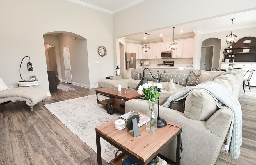 This beautiful Lilac model has been made better than new! This home, on an over sized premium lot, was finished in October of 2019 with many builder upgrades costing over $23,000. The owners have gone even further, including adding custom lighting and beautiful sliding barn doors from the kitchen nook to the expansive patio at the rear of the home. The design, materials and finishes are the latest in interior design and style, from the LVT flooring to the Alpine White cabinetry and Agreeable Grey interior paint scheme. The upgraded kitchen appliances feature a Maytag gas range, dishwasher and microwave, and all are clad in stainless steel. The classic stainless look continues in the kitchen with an upgraded high arc faucet, range hood and satin nickel finish pulls and handles . Plenty of