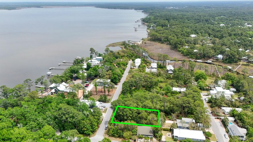 Looking for your slice of paradise? Welcome to Point Washington! This charming, low-key community within Santa Rosa Beach offers the perfect blend of peace, privacy, and convenience. Nestled just minutes from the stunning beaches of South Walton and the vibrant restaurants and shops of iconic Scenic Hwy 30A, Point Washington is your ideal coastal retreat. This exceptional double lot features 100 feet of road frontage and extends 150 feet deep, offering endless possibilities. Build your dream home right in the center for maximum privacy, or divide the lot and create two separate properties -- a rare find in such a sought-after location. With the right floorplan, there's even potential for sparkling views of the Choctawhatchee Bay from a second-story vantage point. Continued... If you're dreaming of a tranquil, nature-filled setting that's close to everything yet feels a world away, this is it. Welcome home to Point Washington, where your coastal dreams can become reality!
