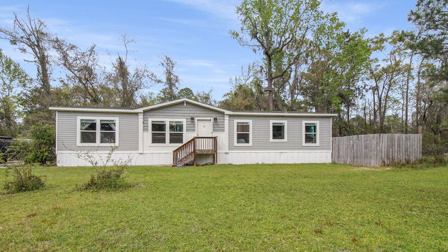 Seller offering $5,000.00 towards Buyers Closing Costs with Acceptable Offer!!! Come check out this beautiful farmhouse inspired manufactured home right in the heart of downtown Freeport, FL. This property features a 3 bedroom, 2 bath split floor plan encompassing 1512 of heated and cooled living space on .44 acres. New Roof in 2022. Enormous cleared back yard. Zoned R-3 with the City of Freeport; possible opportunities await. You would also be minutes away for the public boat launch, city parks, shopping, restaurants, and much more. Call today to make this home yours.