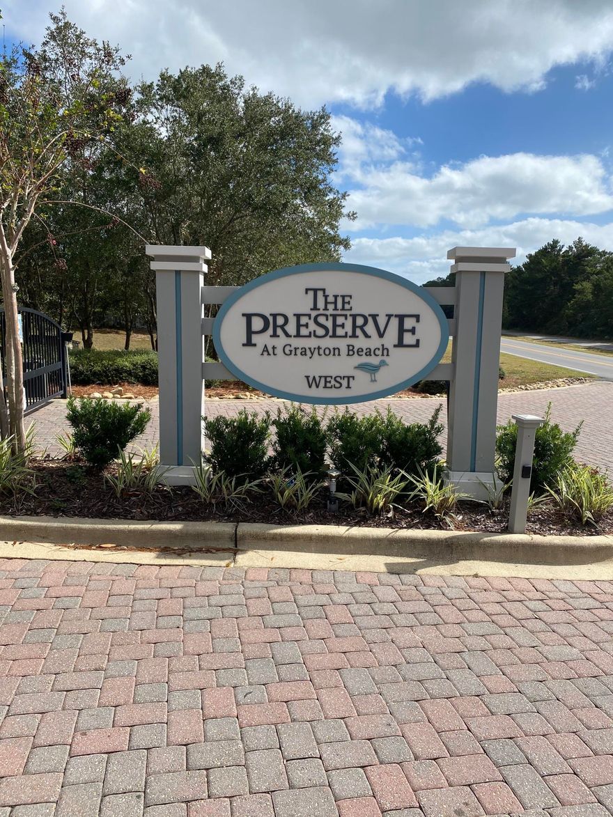The Preserve at Grayton Beach is a gated community, which is surrounded by State preserve. This community offers two swimming pools, tennis courts, club house and a deeded beach access to the beaches of the Gulf of Mexico. This new construction is spaciously designed with four bedrooms and four and a half baths, it has a modern open interior behind a traditional two-story facade. Three porches provide quiet areas for kicking back and enjoying the breeze whispering through the surrounding trees. Featuring high-end finishes including raised ceilings with 12' foot ceilings on the first floor with crown molding.Double pane windows flood each room with natural light while the high-tech air to a heat pump makes this an eco-friendly home to run. A fully equipped open-plan kitchen with quartz