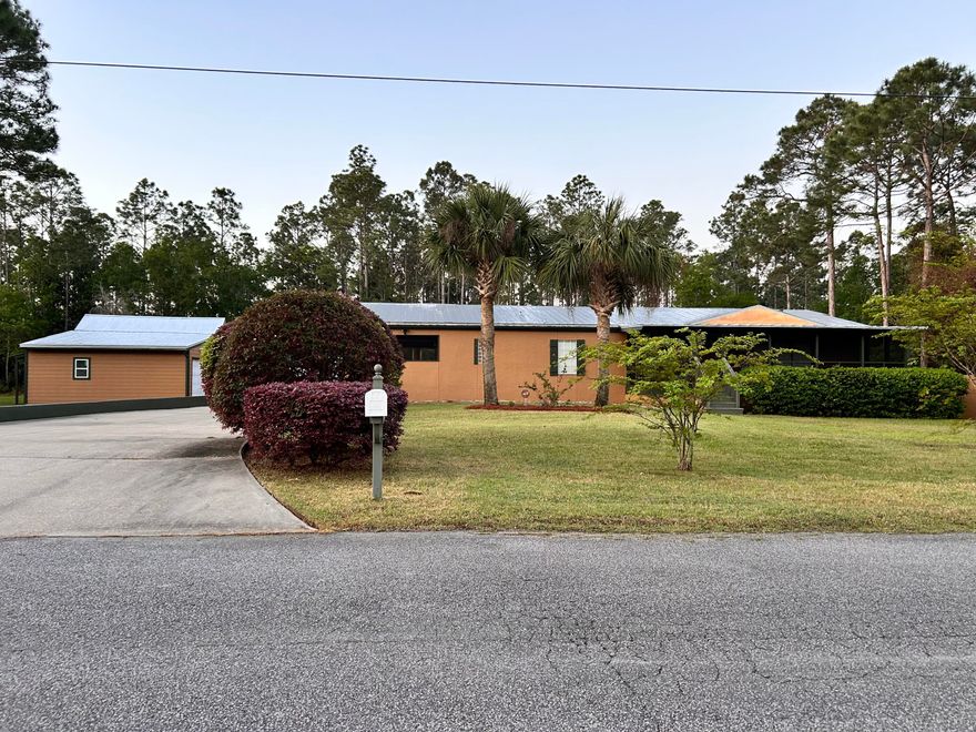 You've discovered an excellent opportunity to own a 3-bedroom, 2-bathroom home in the peaceful Camille Estates subdivision in Santa Rosa Beach Florida. This home is situated on just over .60 acres on a quiet cul-de-sac street. The spacious layout offers ample space inside and out with over 2200 square feet of living area plus a huge enclosed deck for outdoor entertaining. This home has been professionally clad in stucco and finished with a metal roof. Property upgrades include a top quality driveway and multiple out buildings. Work on your projects in one of the two detached buildings. One is a work shop/garage and the other has been used as an office. Enjoy the peace and tranquility of a large country style lot with all the living and work space you need with the added bonus of NO HOA. This property is located close to local Boat Launch and local restaurants.  Enjoy a peaceful country setting just minutes from Santa Rosa Beach and 30A.  Buyer to verify all measurements.
