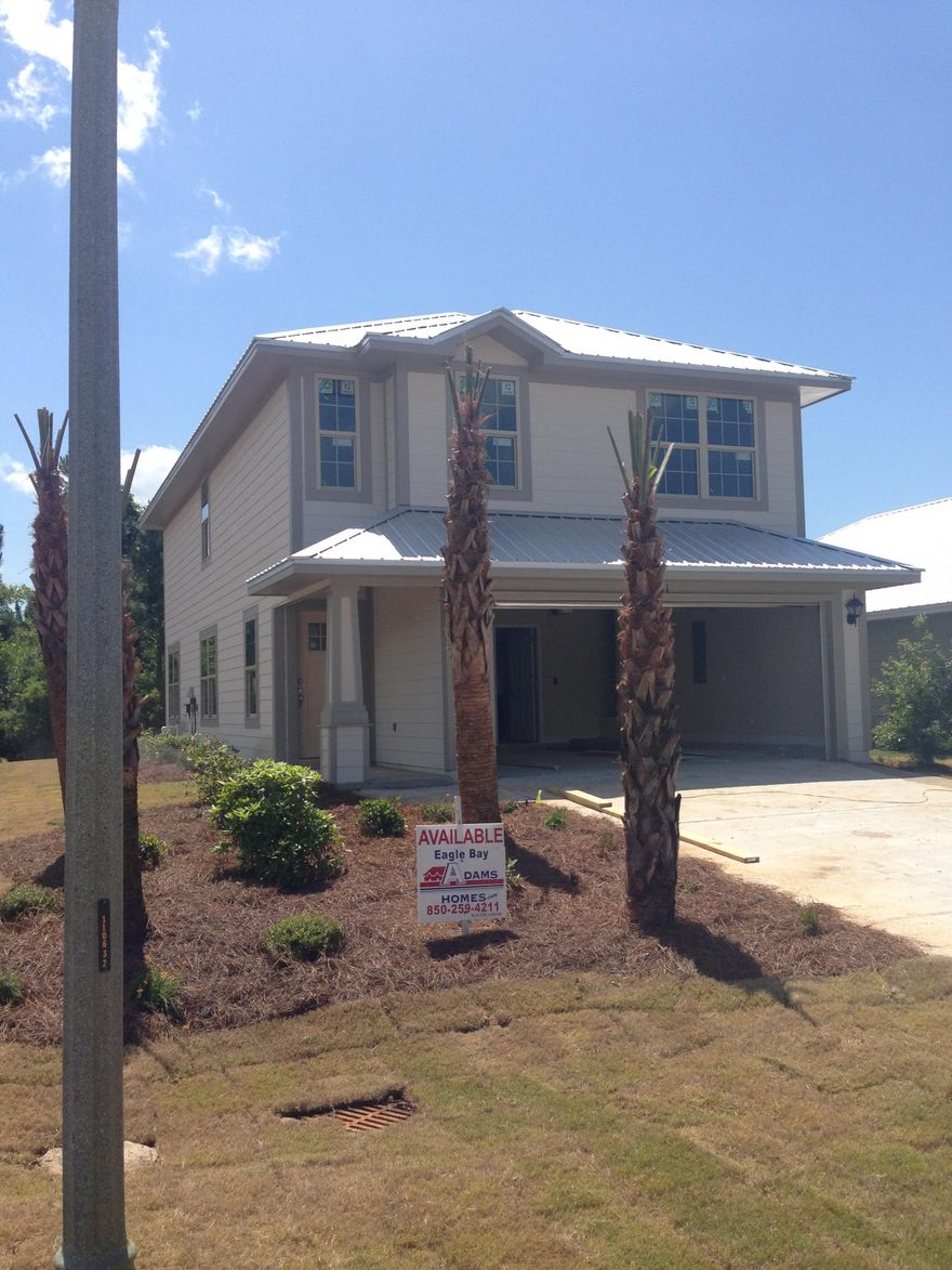 Hardiboard exterior with metal roof and two car garage! This home is one of the last ones built in desirable Eagle Bay! Great location in South Walton, convenient to Sacred Heart Hospital, 30A lifestyle, schools, restaurants, Grand Boulevard, the Beach and the Bay (only 2 blocks to Bay access!) Corner lot! Interior features include granite in kitchen and baths, wood flooring throughout first floor, 5 1/4'' baseboards, Moen fixtures, recessed lighting in kitchen, GE stainless steel appliances and more. One year builder warranty and 10 year Bonded Builder warranty. Low Association fees of $386/yr and Community pool access available for $200/year. Seller pays closing costs with approved lender!(except prepaids.