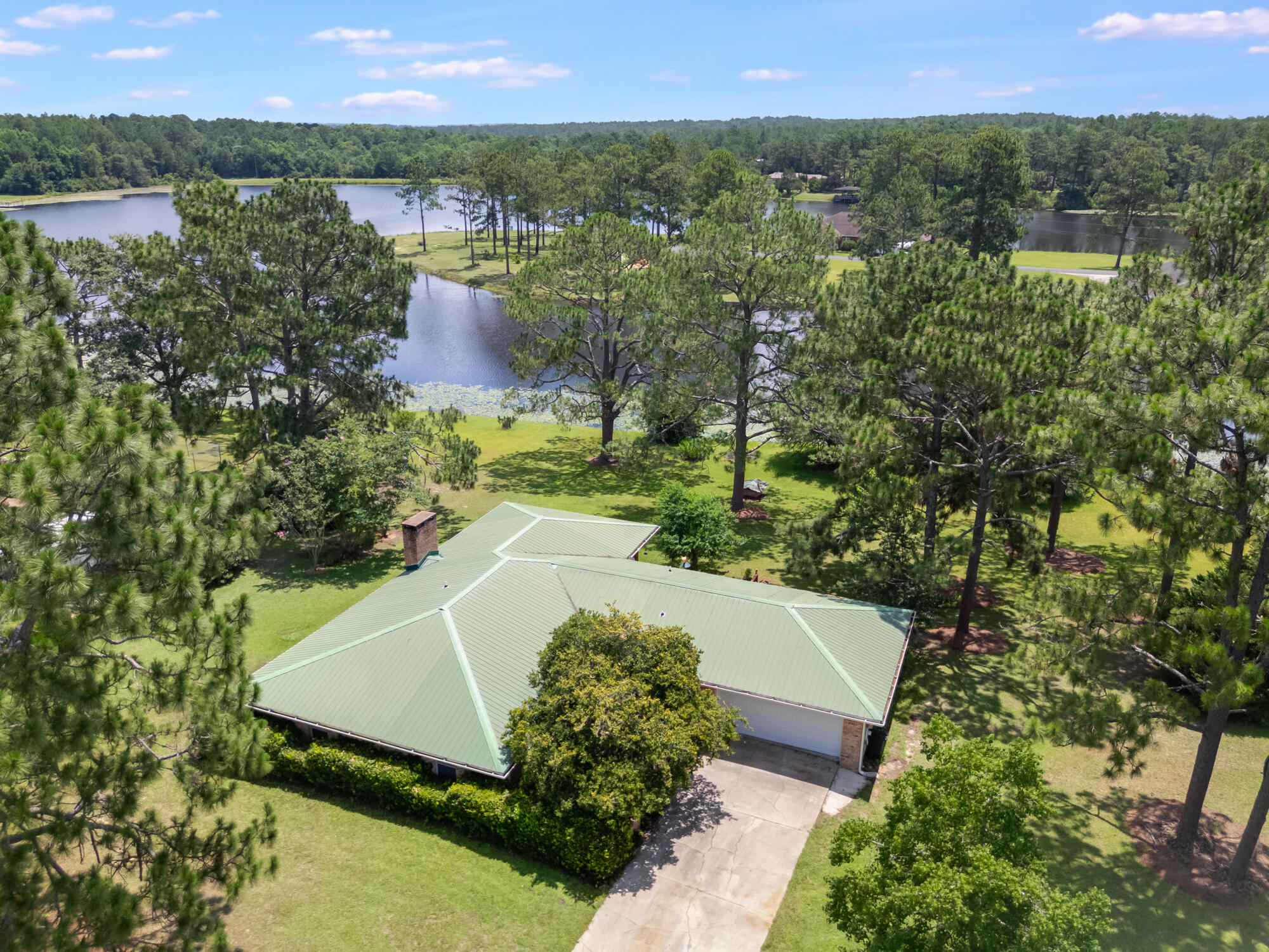 Waterfront living at its finest! This beautifully remodeled 1,898 SF brick home sits on a 1-acre lot directly on the big lake in Ten Lake Estates--one of North Walton County's premier fishing lakes known for trophy bass, bream, and crappie.Fully updated in 2017 by one of Walton County's top builders, this home features modern finishes throughout while retaining timeless brick charm. The spacious great room includes a wood-burning fireplace and flows into an open kitchen and dining area. Enjoy serene lake views from the screened-in back porch--perfect for morning coffee or evening relaxation.Located in a quiet, well-established community, this move-in ready lakefront property is a rare find. Don't miss your chance to own a piece of waterfront paradise!