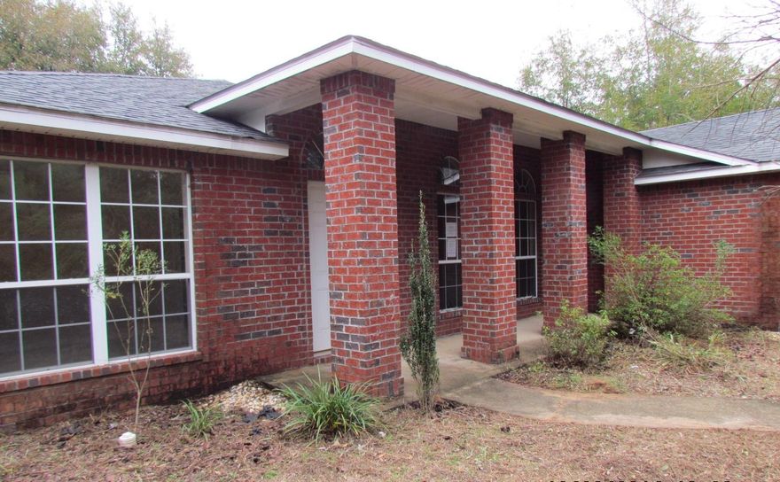 Countrywood Estates in Baker, 4 bedroom, 3 bath split level contemporary house on one acre. When you enter the house the den or study is on your left with french doors. There is a formal dining to your right that looks out to the front yard. The kitchen is very large with a lot of cabinet space and counter top room to include an island. The kitchen is open to both the formal dining area and the great room. The flooring has been upgraded in the main areas. The great room has a sliding glass door to the back yard which is private and partially wooded. The master bedroom is a good size and the master bath has a garden tub and separate shower. There is also a laundry room that is a good size as well. The garage has been converted and is almost complete with french doors. Some work needed.