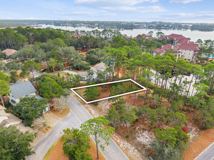 Tucked within the private gates of Wild Heron, 1203 W Water Oak presents a rare opportunity to build your custom coastal retreat on a peaceful pond-front homesite in one of the Emerald Coast's most thoughtfully designed communities. Surrounded by natural beauty and tranquil water views, this lot offers the ideal setting to design a home tailored to your lifestyle, from open living spaces and outdoor entertaining areas to private retreats that take full advantage of the serene surroundings. Here, you have the freedom to create a residence that reflects your vision, all within a neighborhood known for its privacy, architectural character, and connection to nature, while still being just minutes from Panama City Beach, Pier Park, and the sugar-white sands and emerald waters the area is  known for.
Wild Heron is a 734-acre coastal sanctuary with thoughtfully designed resort-style amenities that blend into the natural landscape. Enjoy a four-season heated pool and spa with lake vistas, a modern lakeside fitness center with spa-like locker rooms, a covered waterfront boathouse and pavilion perfect for entertaining with fire pit and BBQ space, community kayak and paddleboard storage and launch, and a 30-slip dock available for long-term boat slip leases. Miles of nature trails, a children's play area beneath grand live oaks, a scenic 1,100-foot lakeside boardwalk, and the iconic Vista Bridge invite exploration and outdoor living. With conservation areas woven throughout and Lake Powell as your centerpiece, this community offers unparalleled access to waterfront recreation, natural beauty, and everyday comfort  all within a gated, private setting. Optional membership opportunities provide access to world-class golf, beach clubs, and additional lifestyle amenities nearby.
Enjoy the freedom to design a home that reflects your vision, all within a tranquil, upscale community that feels tucked away yet perfectly positioned near the best of the Emerald Coast.