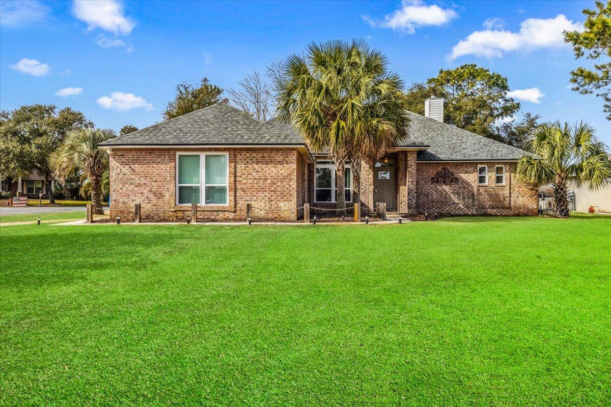 Welcome home to this spacious, completely remodeled, all brick, golf course frontage property with NO HOA. This home is situated on a corner, cul de sac lot on hole #5 of Hidden Creek Golf Course and features a new roof, newer windows, side entry garage, fresh landscaping and an outbuilding large enough for your golf cart with a covered built in bar perfect for entertaining.  Step inside to be greeted by vaulted ceilings, a natural fireplace, open floor plan and no carpet anywhere.  The kitchen features quartz counters, stainless steel appliances, built in wine rack and connects to both a breakfast nook and formal dining. At the back of the house is the ultimate Recreation room with a custom bar, glass doors that recess into the wall and pool table thats included. The primary retreat encompasses one whole side of the home with its own french doors leading to the rec room, a trey ceiling, lots of natural light and a custom barn door leading to the most luxurious, spacious bathroom. Upscale tile adorns the floors and walls with a freestanding soaking tub, walk in shower, dual vanity with granite counters and a walk in closet. 2 generous guest rooms share an updated bath with quartz counters, an oversize tub/shower combo and linen closet. The laundry room connects to the 2.5 car garage that offers extra storage closets and shelves with an epoxy floor.  This home also has an updated HVAC, water heater, septic system and drain field and a whole house Kohler natural gas generator. 