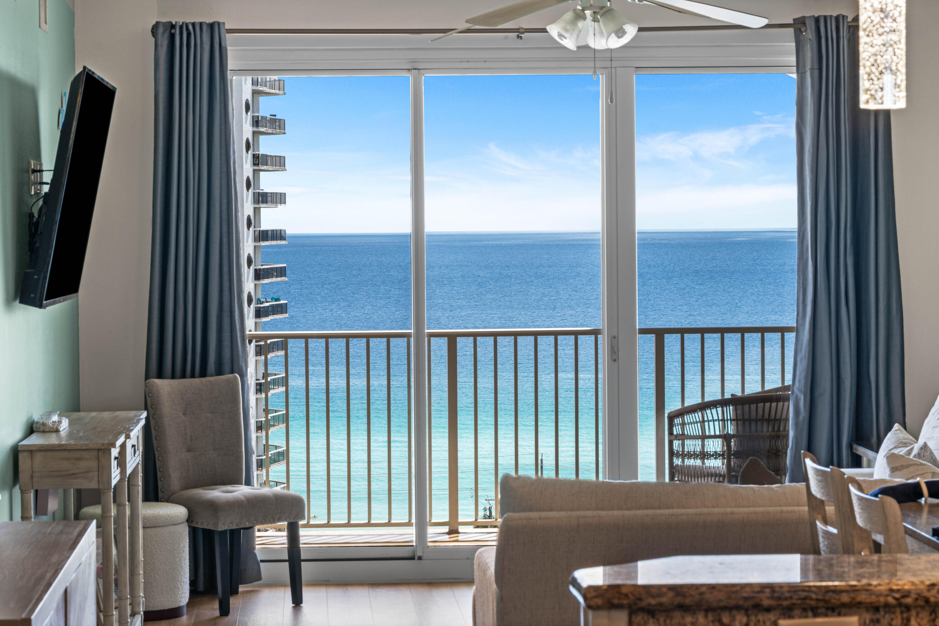 When you close your eyes and are daydreaming about beach living, I'm sure this view and the ocean breezes are what you are dreaming about. This 2 bedroom, 2 bathroom beauty comes completely furnished, making your move a breeze. It will be rental ready for your first booking guest, or ready for you to unpack your personal items and enjoy. This popular resort, includes multiple pools throughout (2 right downstairs), a golf course, pickleball, tennis, basketball court, playground, dedicated beach and beach parking and even a gazebo with grills for your next celebration. Inside you will find a newer HVAC and furniture, all new appliances, new quality vinyl plank flooring, a kitchen remodel with updated kitchen lights, shiplap, new sink and faucet and backsplash.