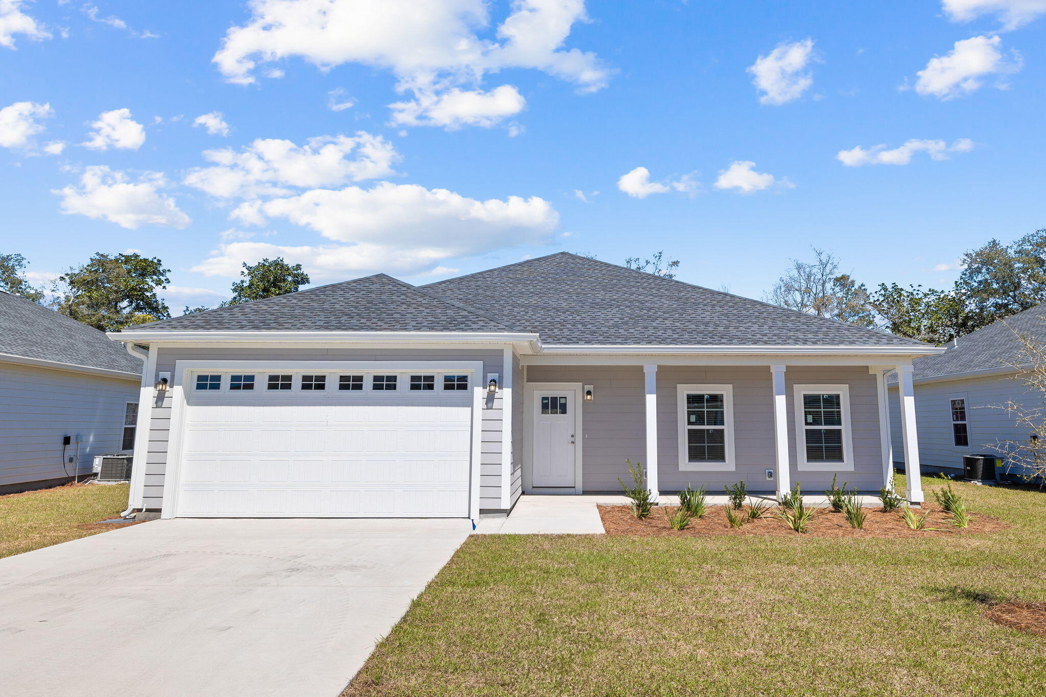 $10,000 toward closing costs & prepaids! Introducing a stunning new construction home in the highly desirable Riverwalk community! This coastal-inspired residence offers a spacious two-car garage, 1850 square feet of living space, and an open floor plan for seamless living. The kitchen features quartz countertops, white shaker cabinets, luxury vinyl plank flooring, and stainless steel appliances. With superior workmanship and an upgraded trim package, this home exudes quality and style. The exterior features fiber cement HardiePlank siding, a covered patio, and the option for a screened porch and fenced-in backyard. A sprinkler system is included for easy maintenance, and the garage comes finished and painted. Plus, the purchase price includes a 2-10 builders warranty.