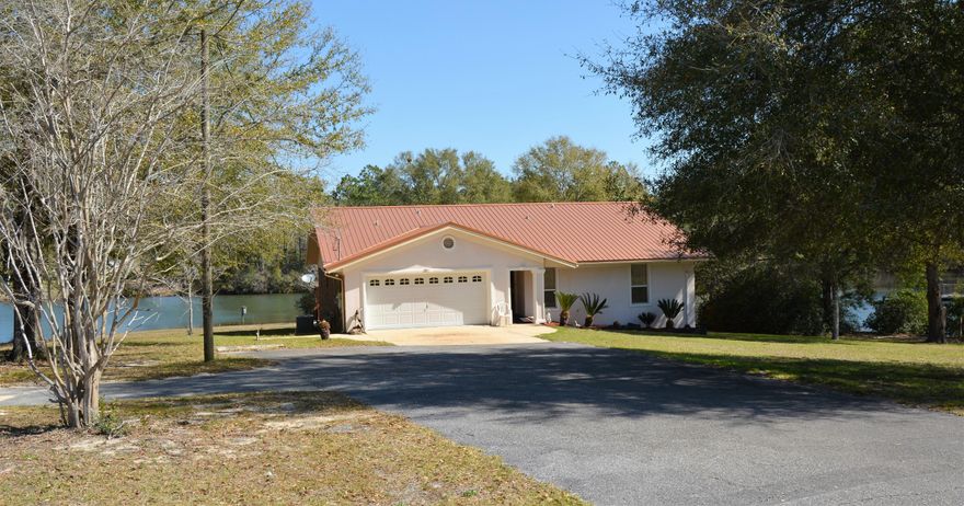 Bring your fishing pole, boat, and horses! This 3 bedroom, 2 bathroom home has a gorgeous view of Mirror Lake with appx. 650' of lakefront with 4 private docks. It has a 700 SF deck that overlooks the lake. The property has 3 lots that cover 3.6 acres with a huge barn that could be converted to horse stalls. There are 3 RV hookups with water and electricity (needs to be reconnected). Inside, the living room boasts 3 sliding doors onto the deck to take advantage of the view along with a wet bar for entertaining. The master bedroom is huge, measuring 25' x 13' and has an attached bathroom with 2 closets, including an extra large walk-in. The attached 2-car garage is also heated/cooled. Square footage verified by buyer.