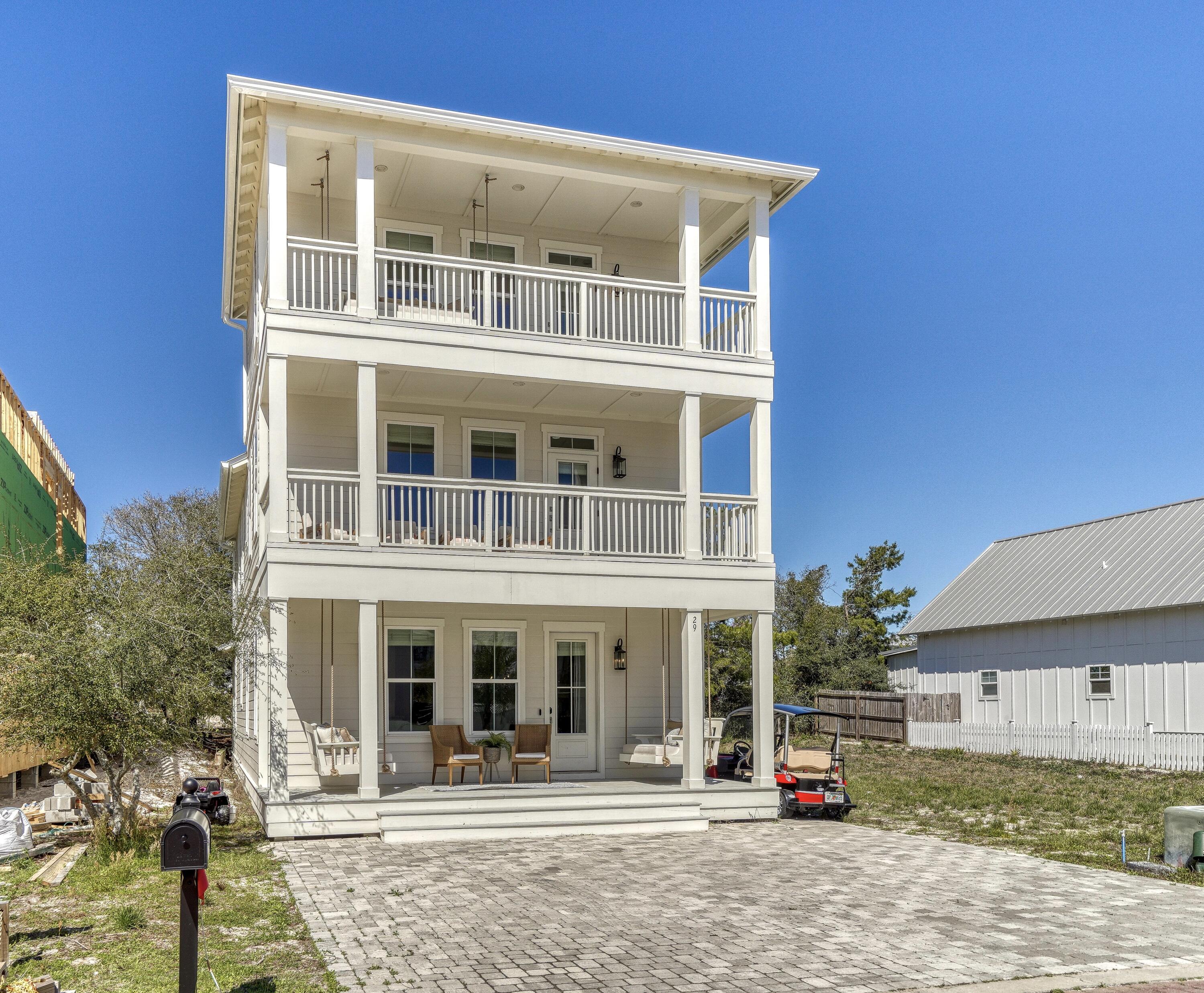 Welcome to 29 tidewater court. Situated perfectly in the heart of Inlet beach south of hwy 98. This coastal retreat brings convenience with the luxury of a multitude of beach accesses just a few steps away. The new owner will appreciate the thoughtfully designed features of high end finishes throughout from lux vinyl plank flooring; custom cabinetry, touches of shiplap walls, pocket doors, decks on every level, and an amazing oversized island. The layout nicely flows bringing an open airy feel ready to host large families yet perfect for a primary, vacation home and even investors. No HOA, space to have a pool installed and home comes furnished. A few minutes from rosemary beach, 30A Avenue shops, dining, etc. Schedule your showing today!
