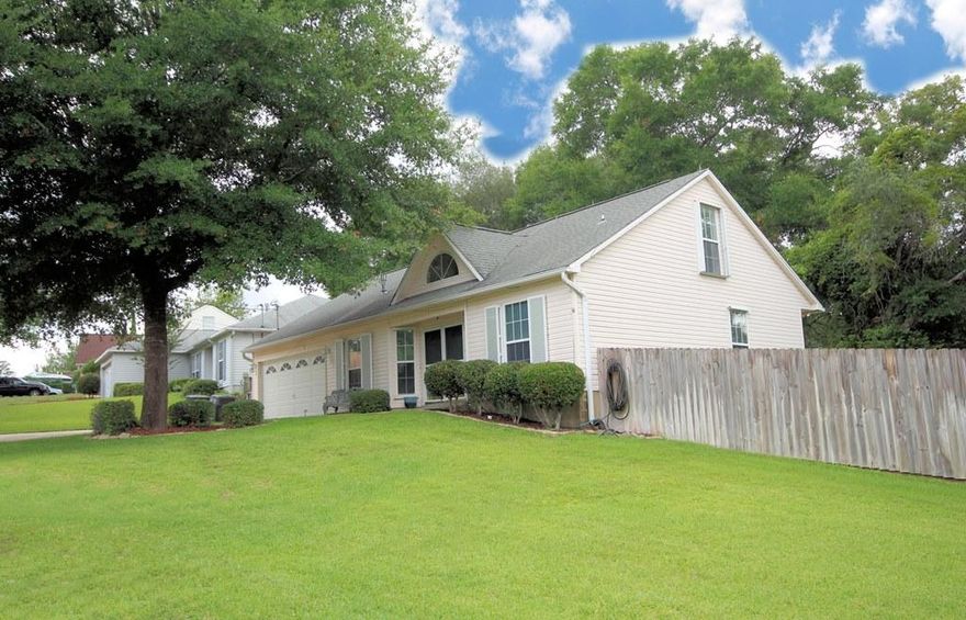 GREAT 4 bedroom home with a screened saltwater pool on a large, fenced corner lot in Valparaiso, just minutes to the East Gate of Eglin AFB! Very flexible floorplan with the master bedroom and another bedroom downstairs and 2 bedrooms upstairs. When you walk into this home through the double front door, you find yourself in the tiled foyer. To the left is the dining room, also with tile floors, and to the right is the downstairs guest bedroom with wood laminate flooring. The short hallway leads you to the family room accented with high ceilings and wood laminate flooring. The family room is open to the tiled kitchen that was updated in 2009 with granite counters and stainless appliances. The downstairs master bedroom also features wood laminate flooring and the tiled master bath offers