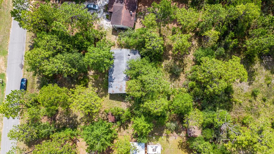 Great Location! 15 minute drive to Navarre Beach, less than 30 minute drive to Hurlburt Field and 5 minute drive to daycares and schools! This high lot features mature shade trees and nearly 1/2 acre of space to build your dream home with no need for added fill dirt! Brand new homes in the $250,000(+) range right around the corner! No HOA and close to everything! Lot has power, water and septic. Old house on lot needs to be torn down to create room for your investment dream in the heart of West Navarre! Why look elsewhere when you can get the best of the beach and privacy to boot!? Home next door for sale that adjoins this parcel for nearly a whole acre at an affordable price and all so close to the beach! Drive by today!