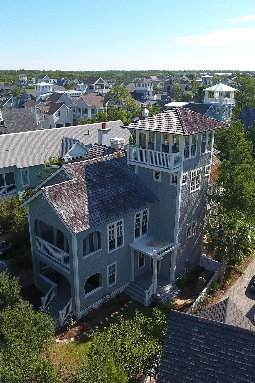 Priced as one of the best bargains in WaterSound Beach, this home is located in a prime location backing up to Deer Lake State Park which offers the utmost privacy and quiet, serene setting as well as a short stroll to the beach. The home is being sold fully furnished and has a freshly painted exterior and porches. It is a must see with excellent rental potential of over $164,000! The current owners have DRB-approved plans for a garage designed by Geoff Chick, in addition to new landscaping plans including a fire pit which will convey to the new buyer. The oversized lot provides ample space for other additions, for example, a pool as well. The home has never been rented so it is in great condition.The spacious floor plan is ideal for entertaining and family getaways and would make a great