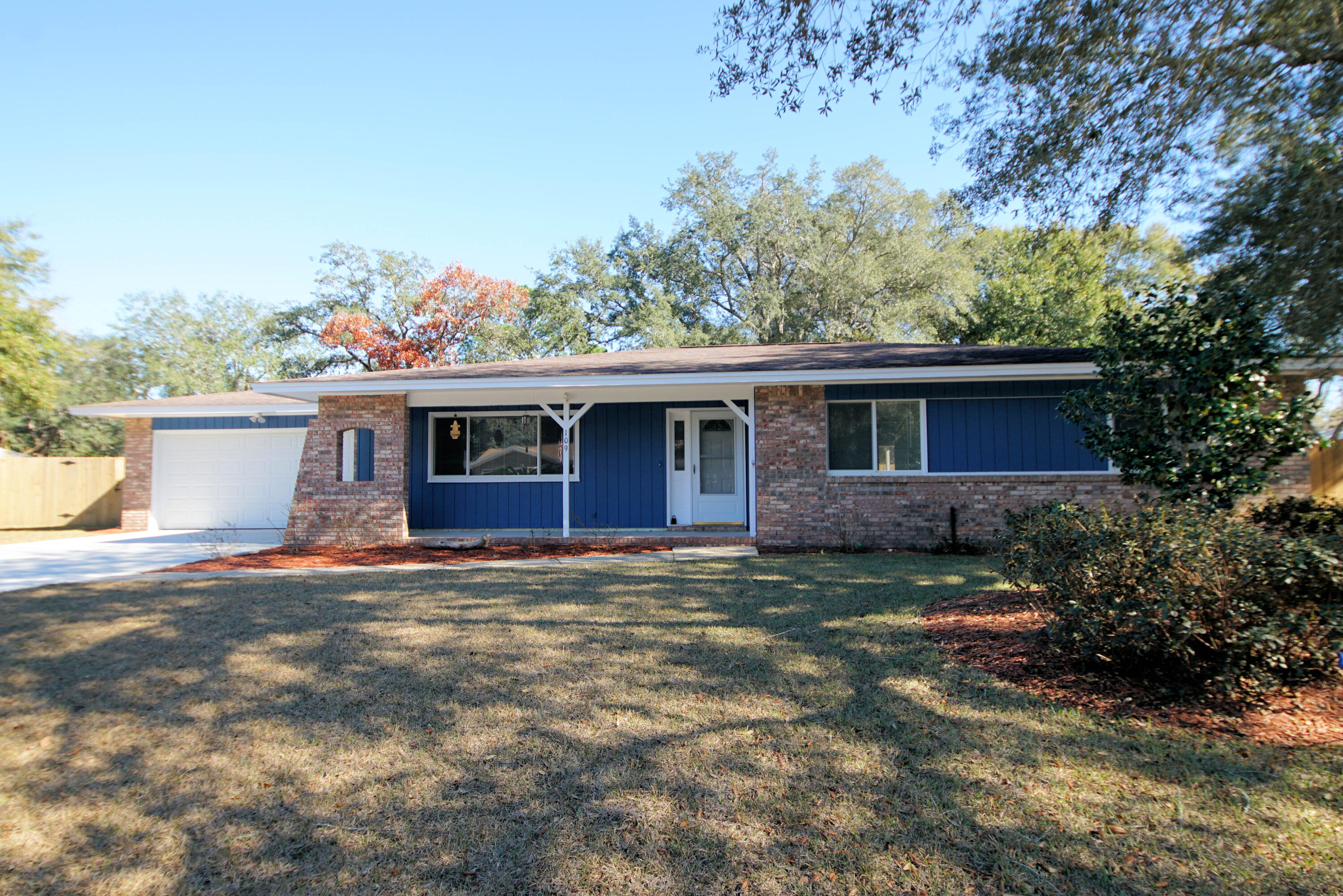 Here is your opportunity to own this lovely move in ready home in the heart of Niceville. Spacious 4 bedroom 2 bath home has been freshly painted inside and out. Lovely hardwood floors throughout the main living areas with carpeting in the bedrooms. Spacious master bedroom features it's own bath with newer tile shower and wood look tile floors. There is plenty of space to spread out with three additional bedrooms. Backyard w/ a shed, a large covered patio, and a new wood fence. New landscaping in the front yard complete with new sod. Attached is 2-car garage with a new concrete driveway. Home has been updated with Pex plumbing, vinyl windows, and doors. The house also comes with a gas generator and more! Lawn pump and sprinkler system are being sold 'as is'.