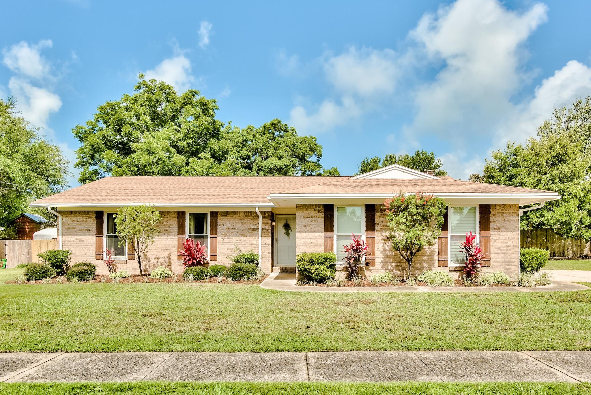 This 3BR/2BA brick home in the heart of Destin has been recently updated! New flooring, granite countertops, new appliances, and built in shelving in the garage. There is a screened in back patio great for entertaining, along with a beautiful fireplace in the living room. Sprinkler system, privacy fence, and a two car garage.Amazing location! Walking distance to Destin Elementary. Close proximity to the Harbor District. New HVAC and water heater in 2018. New lawn pump in 2021. The home was reroofed in March 2013.