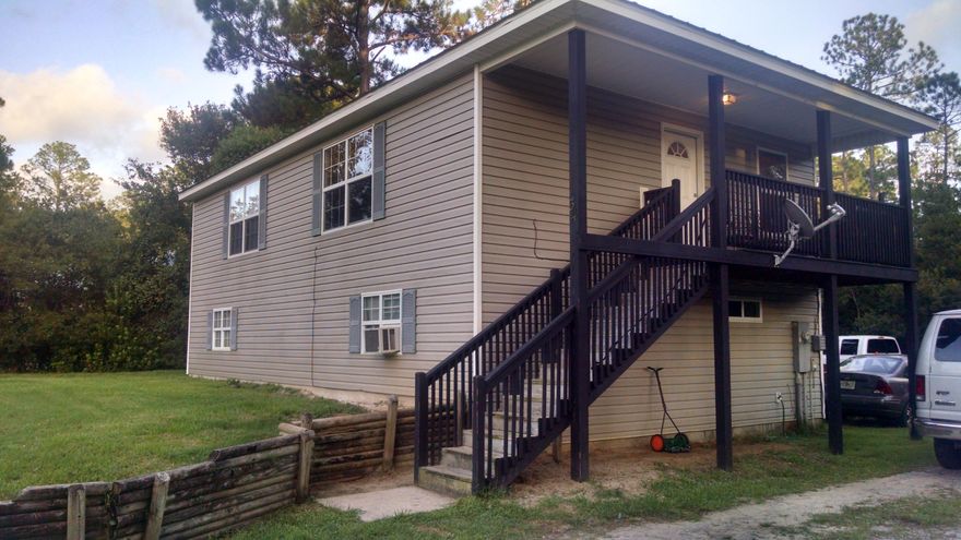 Great home at a great price minutes from the sugar beaches and the Choctawhatchee Bay. The whole bottom level is used for garage/work shop but is studded in on slab, so could be enclosed with a little work. The living area has a very spacious feel equipped with pine flooring. When you walk in the door it feels like home. Don't pass on this chance to own in South Walton for under 200K