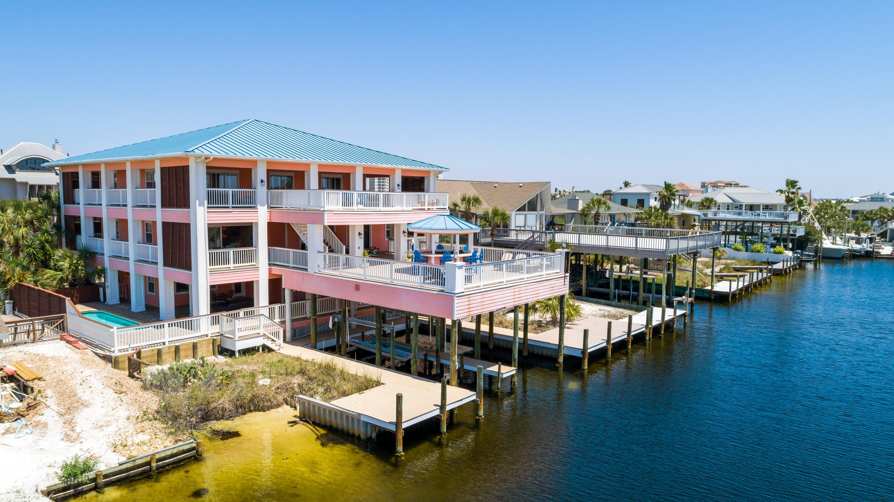 Awesome waterfront home on beautiful Holiday Isle canal with over 13,000 sq of home and decks , 5,574 sq ft heated and cooled !!! This will make a great family retreat or a vacation rental machine!!! Boaters Dream on fabulous Holiday isle! Spectacular 3 story custom built 6 bedroom waterfront family retreat. Dockage for four large boats. Two covered slips, one with boat lift. Great for entertaining or just living the good life. Gulf and Destin Harbor views. Pool and wraparound sundecks. Private beach access and canal maintenance included in Holiday Isle Association fees. Lots of room and privacy on 3 levels of living space , all levels accessible by elevator. Master suite on 3rd level has a separate sitting area and large spa-like bathroom.