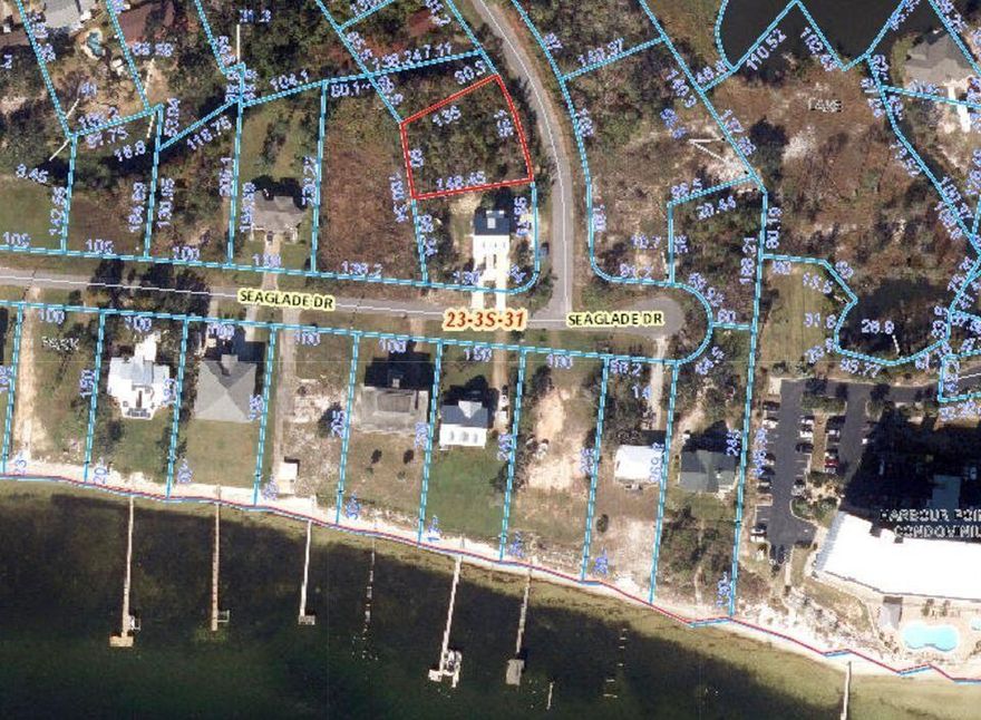 Residential buildable lot right across the street from the beach. Build your dream home here!  Utilities at the street and a beautiful park on the bay included in your HOA dues