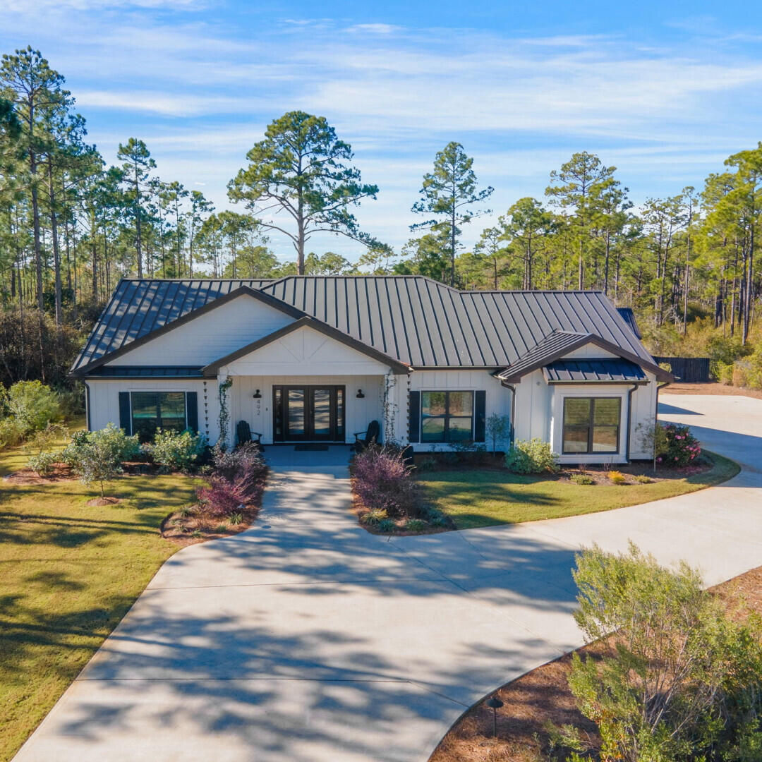 This 4 bedroom, 3.5 bathroom ranch sits on 1/2 acre in Seclusion Bay, one of the most desired neighborhoods in Santa Rosa Beach. The neighborhood is known for both privacy & community with large yards, mature trees, dozens of families, a community dock and the safety of gate and no thru traffic. Property includes a gorgeous heated pool with water feature, quartz countertops, LVP flooring, floor to ceiling tile in all of the showers, a home gym complete with a/c and 2 gas fireplaces. This home is turn key in every way!