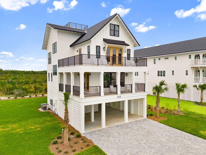 Introducing a striking four-level coastal haven that rises above Sugar Sand's quiet shoreline with style, comfort, and rare panoramic gulf views. Thoughtfully crafted in 2025 and fully furnished for an effortless arrival, this 3,477-sq.-ft. residence pairs modern architecture with refined coastal design to create an elevated retreat only steps from the beach.Set on an X-flood-zone homesite with impressive third-tier gulf vistas, the home offers a layout designed for both privacy and connection. Multiple king suites span the second and third floors, each with walk-in closets, custom shelving, and serene ensuite baths. A bunk room on the upper level adds family-friendly flexibility, while a private elevator glides between all four floors for seamless movement. The main living level is airy and inviting, wrapped in soft coastal tones and anchored by an open chef's kitchen with quartz surfaces, a generous island, premium appliances, and abundant storage. Recessed lighting, crown molding, intentional detailing, and curated furnishings elevate every space, creating a refined atmosphere suited for extended stays or high-demand rental appeal.

At the top of the home, a coveted fourth-story viewing balcony delivers an unforgettable vantage point where sweeping gulf horizons and postcard sunsets feel close enough to touch. Morning coffee and evening wine both find their perfect moment here.

An expansive driveway and covered parking accommodate six or more vehicles, offering a rare level of convenience for beach living. Outside, the gated Sugar Sand community enhances the experience with quiet streets, deeded beach access points, and anticipated resort-style amenities, including a gulf-front clubhouse with pool and fitness center, boutique shopping, dining, and landscaped common areas.

Steps from the uncrowded shoreline of Mexico Beach and designed for comfort, longevity, and turnkey enjoyment, this remarkable coastal residence presents a rare chance to own a brand-new, fully furnished luxury home in one of the Forgotten Coast's most desirable settings.
