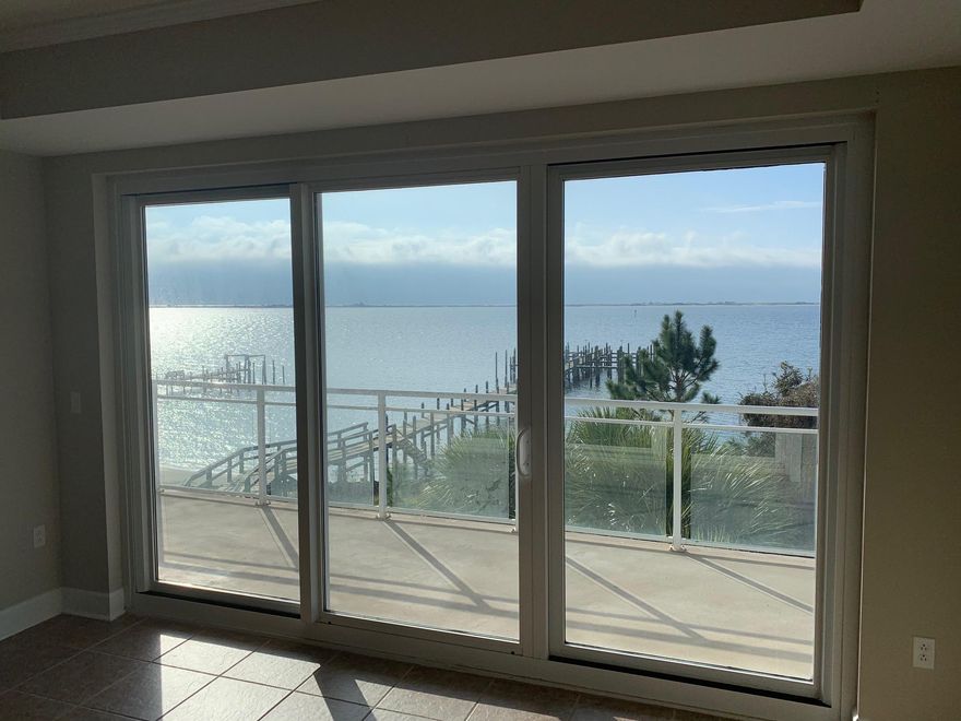 Waterfront living on the Santa Rosa Sound with unobstructed views of the gulf over Santa Rosa Island. Beautiful 3 bedroom 3 bath condo with dock, water side pool, covered parking and elevator service. Gated community that is fully landscaped, fire sprinkler and alarm system, water & sewer in HOA fees. Building was finished in 2007 and complete refurbish and repaint of exterior completed in 2017. Tile and carpet floors and granite counters with Stainless appliances. Kohler bath fixtures, owners lockout and pantry with full size washer dryer hookup. There are no rental restrictions and the property is pet friendly to 20 lbs. All rentals since 2009 have been long term. Includes in water boat slip