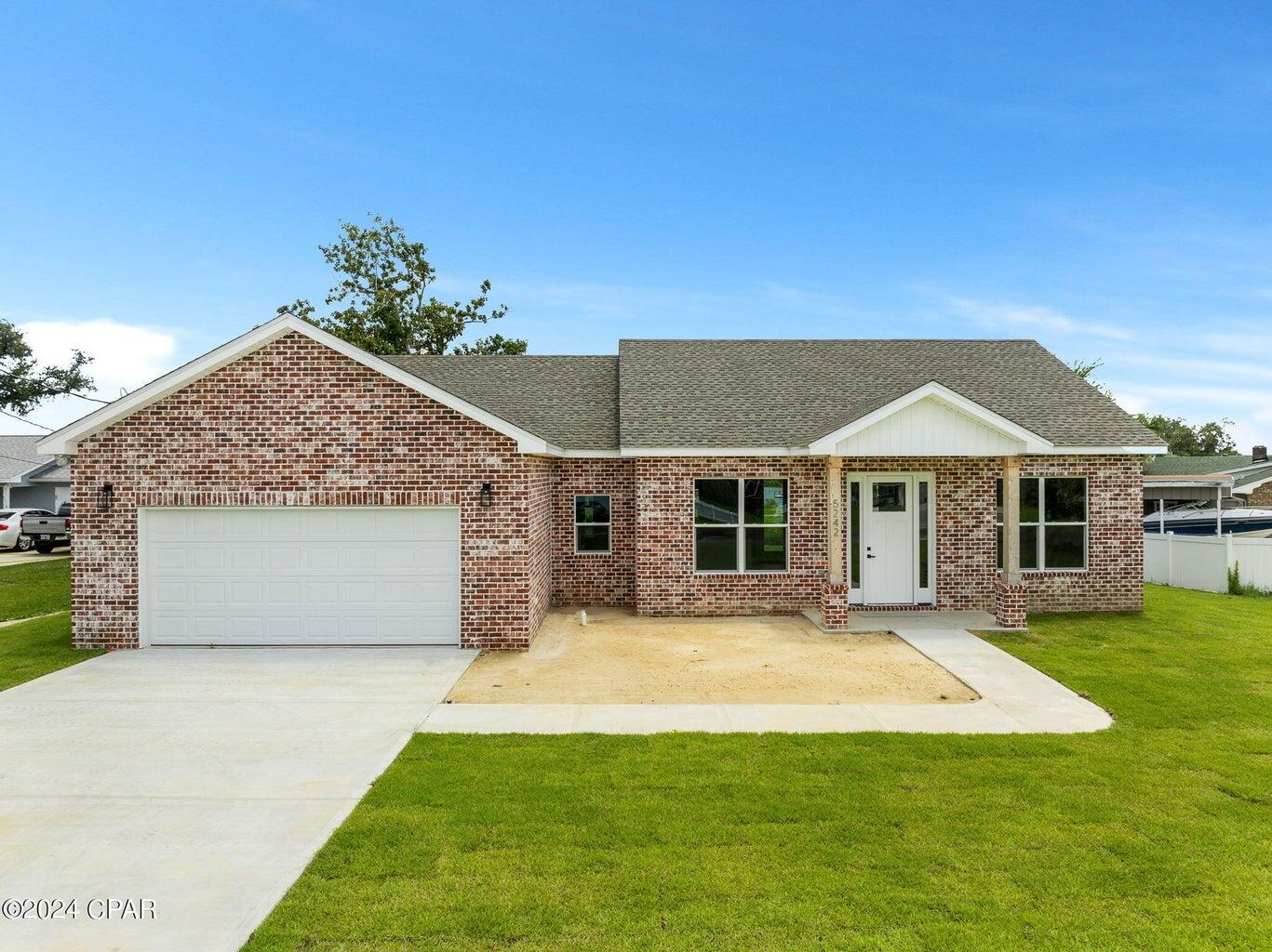 Welcome to this Stunning New Construction home located close to Tyndall Air Force Base! This spacious 3 bedroom, 2 bathroom home features a split bedroom floor plan, offering optimal privacy and comfort. As you enter, you'll be greeted by 10-foot ceilings and 8-foot doorways, and an open concept floor plan creating a spacious and inviting atmosphere throughout. You'll enjoy the upgrades this home provides such as wood look tile flooring, plush carpet in the bedrooms, a kitchen island, upgraded appliances, granite countertops and a walk in pantry. The master bedroom comes complete with its own en suite providing a private retreat. Additionally, the oversized laundry room and garage offers ample storage. As you step outside you will enjoy the oversized backyard with a water view! The builder spared no expensive by adding spray foam insulation in the exterior walls and roof. Call your agent and tour this home today!