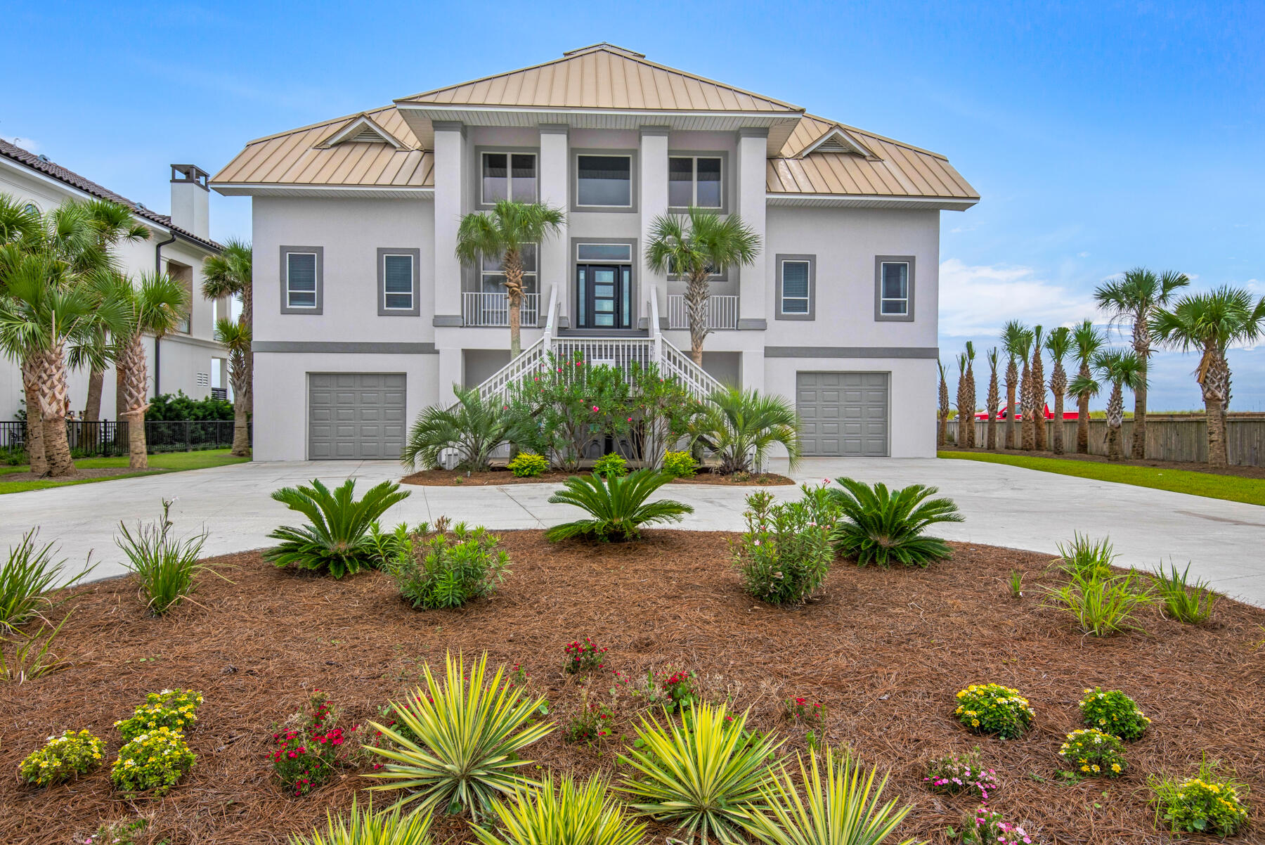 Aptly named ''The Oasis'' this spectacular 4 Bedroom 3.5 Bath Gulf Front home rises above 100 feet on Navarre Beach offering unparalleled sunrise and sunset views.  Custom designed and attractively furnished with 3777 heated and cooled square footage, as well as generous outdoor living spaces on both levels delivering an exceptional waterfront living experience.  Expansive open concept living area with soaring ceilings and floor to ceiling windows showcasing the breathtaking gulf views.