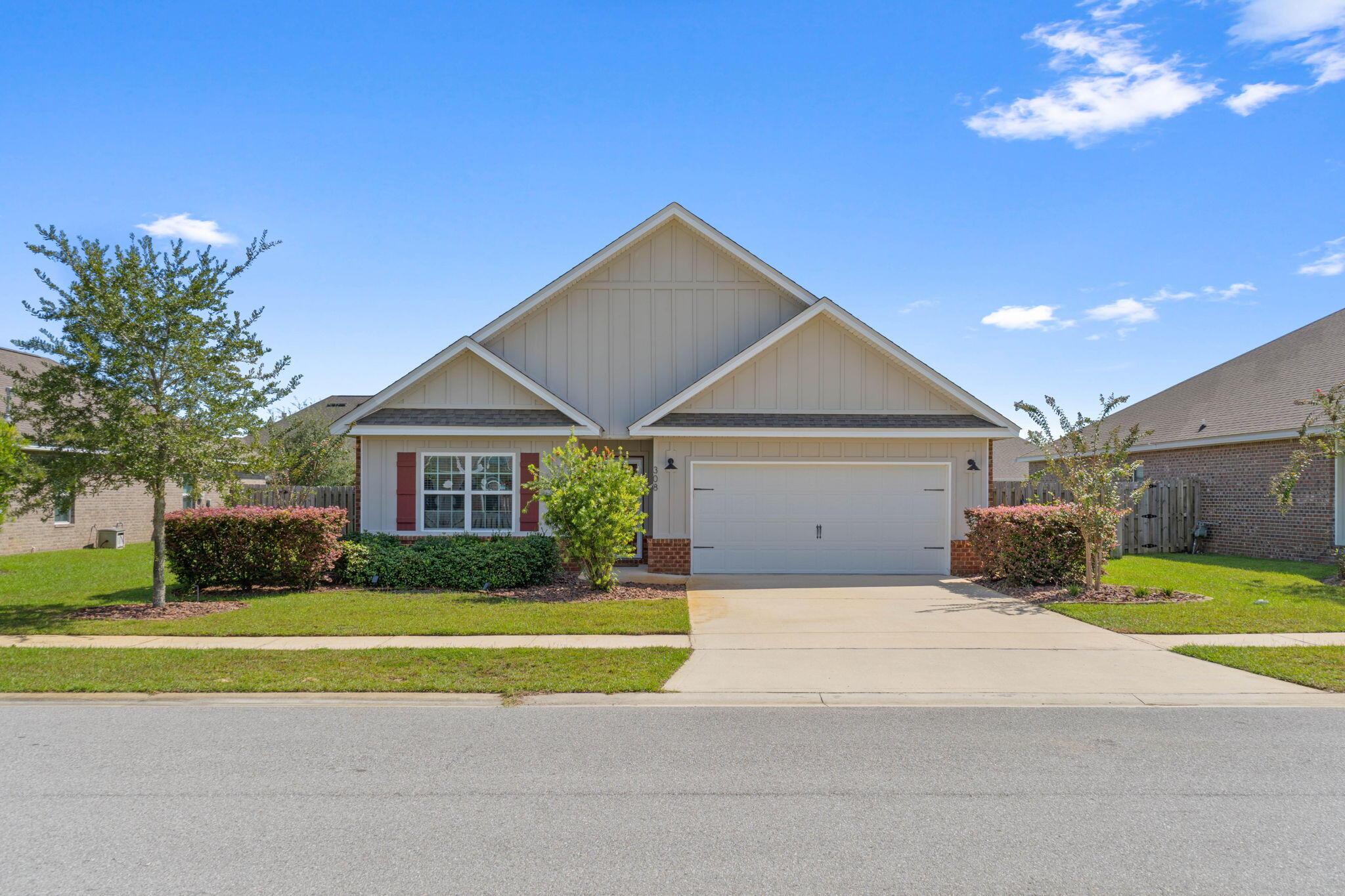 Beautifully crafted, this home boasts 3 sides of brick and stylish details throughout. Enjoy the convenience of a gas water heater and gas stub for grilling and a gas stove. The kitchen and baths feature granite countertops, while the master suite offers a luxurious tile shower. The home is equipped with stainless steel appliances, including a microwave, stove, and dishwasher. Solid floors flow through the common areas, with 16'' tile in the baths and utility room, and plush carpet in the bedrooms. Crown molding, brushed nickel fixtures, and designer lighting add an elegant touch to this stunning home.