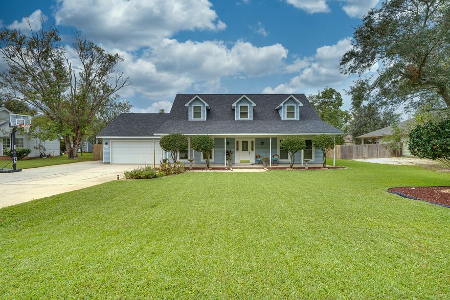 Tropical Oasis in your own backyard! POOL home in East Navarre! This home is beautiful both inside and out. Spacious living room with soaring ceilings and fireplace. Second living room that would be a perfect movie room! Large office. Updated kitchen with granite counters, breakfast bar and stainless appliances. Dining room overlooks the tropical backyard and pool. Master suite is downstairs and a fantastic size! Beautiful Master bath has been updated. Step out the door to the back covered patio that is almost the length of the house. The perfect place for your morning coffee on the swing! The pool and mature palm trees make this feel like you're on vacation! Upstairs are 2 generous bedrooms and a bathroom. No carpet in this home! Additional parking. No HOA.