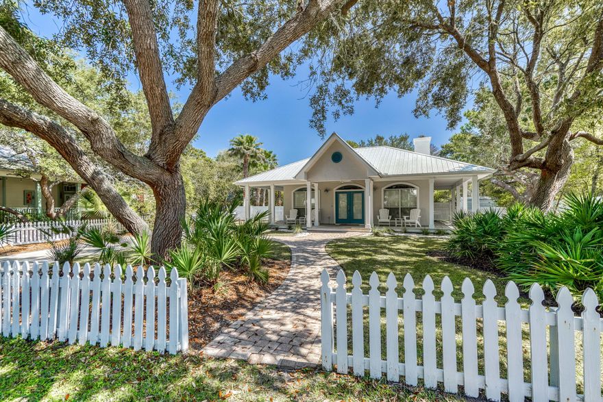 Are you ready to be a LOCAL and experience relaxed beach living at its finest? Or are you looking for a brilliant income producing rental? This custom built, and updated 3 bedroom 2 bath home nestled in the native twisted oaks of Seabreeze East is just steps to the sugar white sands of the Gulf of Mexico. Brick pavers lead you to the quintessential characteristic of Southern charm: deep shaded porches. Enjoy rocking grand babies or greeting neighbors from any vantage point, because these porches wrap around three sides of the home. Once inside, the open floor plan and large windows help make this house warm and inviting. The built-in buffet can boast your wine selection or serve as an extra space for a creative coffee bar. The master bedroom is spacious and has its own exit out to