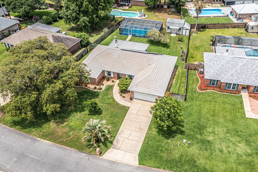 Welcome to paradise in Bluewater Bay at Raintree Estates this exceptional 4BR/2BA home is nestled on a spacious 1/3 acre, offering you a private retreat in a desirable location. With this well-designed layout & numerous amenities, this property is sure to captivate your attention. As you step inside, you'll appreciate the thoughtfully designed split bedroom plan, providing optimal privacy and functionality. The home boasts an inviting dining room, a versatile study, a comfortable great room, and a generously sized eat-in kitchen. The master suite is spacious and features a garden tub, a separate shower, two walk-in closets, and double sinks. Your own personal oasis awaits you in the backyard. Take a refreshing dip in the screened in POOL or unwind on the 24x12 screened porch by savoring-->