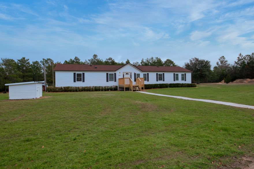 Check out this completely renovated home on almost 10 acres of property.  This home has been  upgraded and renovated from the subfloors to the ceiling with updated electrical, plumbing, kitchen cabinets, counter tops, and flooring.  The roof and a/c were replaced in 2018 and the wells were replaced in 2019  As you arrive on the property you are welcomed by the long winding black top driveway.  The welcoming porch was just rebuilt.  As you enter the front door you are welcomed by the spacious family room with new vinyl plank flooring.  The kitchen has plenty of room for large gatherings of family and friends.  The home features two living areas and a large office with a built in desk.  The master bedroom has plenty of room for all your furniture and has a huge walk in closet.  The home has lots of storage space with three of the four bedrooms having walk in closets and the laundry room also has a great pantry area. There is a front and back porch to enjoy the great outdoors.  The entire property has been fenced and there is a 28x 40' barn, 30 x 60' carport and 2 Conex storage containers. The home features 2 wells and a Centurion generator system.  