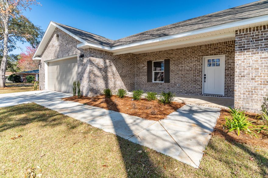Custom Built Home for this location! Offering 4 Bedrooms to include a split floor plan master & a bedroom with ensuite! Upon entering this thoughtfully designed home, you'll immediately appreciate the expansive open-concept living area that seamlessly connects the living room, kitchen, and separate dining room. The abundant natural light enhances the inviting atmosphere, making it perfect for both daily living and entertaining. The kitchen is a standout feature, equipped with soft-close cabinets and drawers, quartz countertops, sleek stainless steel appliances, and an oversized walk-in pantry, ensuring both functionality and style for all your cooking needs.The interior features include luxury vinyl plank (LVP) flooring throughout, offering durability and a sophisticated appearance All bedrooms are equipped with oversized walk-in closets, providing ample storage space. The expansive laundry room includes custom cabinetry and countertops, enhancing functionality. An energy-efficient HVAC system ensures year-round comfort while minimizing utility expenses.
The master suite, strategically positioned on one side of the house, ensures privacy from the additional bedroomsa hallmark of the split floor plan. The master bathroom offers a luxurious retreat, complete with a walk-in shower, a separate garden tub, 2 separate vanities, water closet, and a spacious walk-in closet, providing both comfort and functionality. 3 large bedrooms are located on the opposite side of the home. The 4th Bedroom with private ensuite bathroom provides opportunity for private guest room or mother-in-law quarters.
The home's exterior features an all-brick construction complemented by hurricane-impact windows and doors throughout, providing enhanced protection and potentially lowering insurance costs. Relax in the fully privacy-fenced backyard, complete with two side gates for easy access, and enjoy a full irrigation system, including a well pump, ensuring a vibrant outdoor space with minimal effort. The expansive covered porches (both front and back) are designed for outdoor living, featuring recessed lighting and ceiling fans (back) for added comfort. A durable 30-year shingle roof offers protection and peace of mind for years to come.
Situated within minutes of Eglin Air Force Base, Hurlburt Field, local hospitals, schools, shopping, dining, entertainment, and a short drive to the beach, it provides unparalleled convenience for both work and leisure.