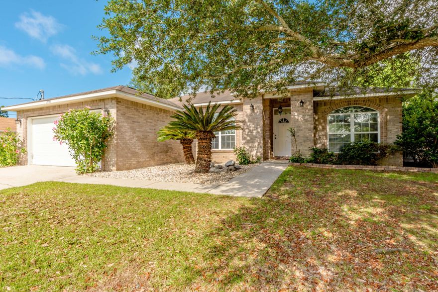 Welcome home! This 3 bedroom 2 bathroom home has fresh paint and is well kept with a functional split floor plan and layout. The kitchen area boasts of a built in desk area perfect for those needing that extra office space and perfect for working from home! You'll also enjoy the open floor plan with a formal dining room and high ceilings. Looking for that 3 car garage? This house has it! Located in the backyard, you can access your 240 sqft third car garage with electricity via the double gate on the north side of the house. Also perfect for boat and RV storage. Enjoy relaxing in your oversized backyard while picking fruit from your very own Pear tree, Fig tree, Blueberry bushes AND Blackberry bushes! This home has also been upgraded with the rebuild Northwest Florida program providing