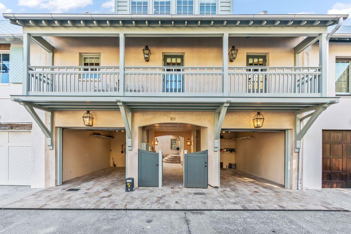 Prominently situated overlooking the iconic Cabana Pool on the Northern side of Rosemary Beach, this quintessential West Indies inspired compound style home offers a rare combination of inspiration and value, rarely found in today's New Urbanism markets.Providing a reverse living floor plan, this three level property offers a spacious two-car garage, master suite with his and her private bathrooms, and a guest bedroom with private ensuite, all with easy ground access to the adjacent community pool and walkways throughout the town. The main level of the home also offers a charming enclosed patio with hot tub and lounge style seating, perfect for enjoying morning coffee or afternoon cocktails in a private, vegetation rich environment.