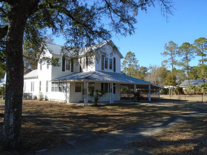 If you are looking for a historical home that you can make into a jewel, this is it. Sellers have taken care of home, updated electrical, added central air and heat downstairs plus a metal roof. The upstairs is original with wood floors, tongue and groove floors, walls and ceilings. There is an extra room upstairs that could be converted to any use. Downstairs are 2 fireplaces, beautiful old French Doors in 2 rooms plus 2 additional glass pane doors. Much of the glass is original. Wide base boards are through out. Classic breezeway (7.6x26) through the center of the house. 7.6x8 landing at the top of the stairs. Property is located on 3 City lots which should allow for a second building lot. Property is fenced. City sidewalks on 2 sides. Walking distance to Lake DeFuniak.