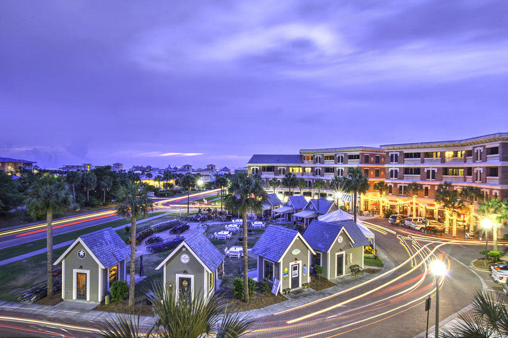 Ideally located just a short stroll from Rosemary Beach to the east and Alys Beach to the west, The Village of South Walton is a hub for entertainment, shopping, and food. This three bed, three bath condo sits above the central entertainment area with pocket views of the gulf from the private balcony accessed from the living area or master bedroom. Updated with beautiful wood and travertine flooring, this fully furnished condo is ready to be enjoyed as a second home or smart rental investment at the beach. Owners at the Village enjoy Seacrest Beach's deeded beach access and beautiful 12,000 square foot resort-style lagoon pool amenity.