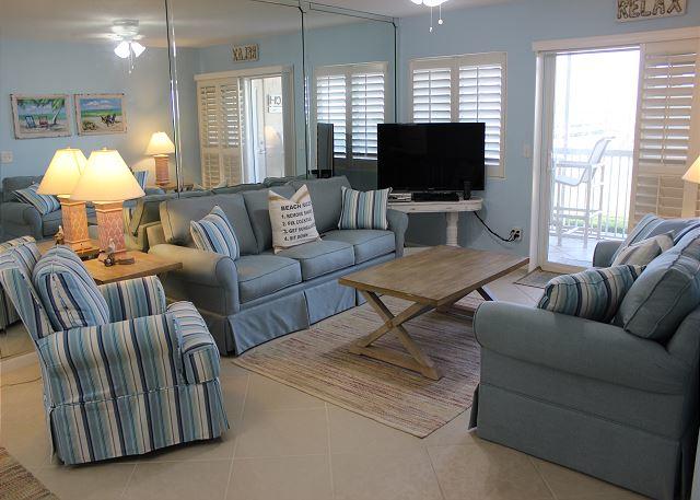 Relax in this newly decorated beach paradise! Unit 102 is a 2 bedroom, 2 bathroom ground floor and*** one of VERY FEW that offers a WASHER and DRYER***, gulf front condo that comfortably sleeps 8 with a king bed in the master bedroom, a full bed and a set of bunk beds in the guest bedroom, and a sleeper sofa in the living room. This condo has been completely re-furnished with brand new furnishings and fresh paint and tile throughout. A 55'' HDTV located in the living room or enjoy watching a complimentary DVD on the new 32'' HDTV in the guest bedroom. The master bedroom is equipped with a 32'' HDTV and en suite bathroom. Enjoy the privacy of being located on the western end of the complex with direct access to the beach straight from your private patio. New stove, W/D and AC 2017