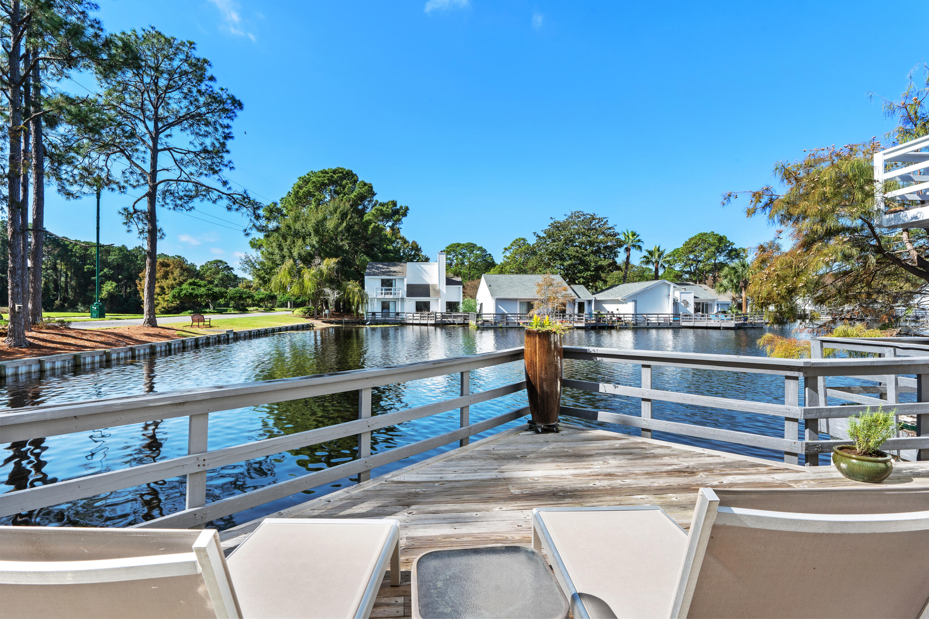 Enjoy your morning coffee or your afternoon cocktail on your expansive deck overlooking the Linkside lake and illuminated fountain. This updated, three bedroom, two bath cottage is tastefully furnished, meticulously maintained  and ready to be occupied. The living room, master bedroom and dining room patio doors open up to the large deck providing outdoor living at its best. The kitchen has stainless appliances and quartz  counter tops. BOTH bathrooms updated and bedroom's feature custom California closets.  Roof replaced in 2017 and the exterior has just been completely painted! Paver driveway with enough space to add a carport if desired. This adorable ONE LEVEL  cottage would be an excellent family getaway, a rental property or a full-time residence. Sandestin Golf and Beach Resort features more than seven miles of beaches and pristine bay front, four championship golf courses, 15 world-class tennis courts, a 226-slip marina, a fitness center, spa and celebrity chef dining. Shop, dine and play at the charming pedestrian village, The Village of Baytowne Wharf and more. Inside the gates of the resort, residents enjoy a balanced lifestyle of high-class living, spanning the 2,400 acres from the beach to the bay. Everything within the gates of the resort is accessible by golf cart or bicycle. The entire resort is interconnected by miles of pedestrian, bike and golf cart paths that weave through groves of live oaks, meandering past natural lagoons, fountains, man-made lakes, and meticulously landscaped fairways.