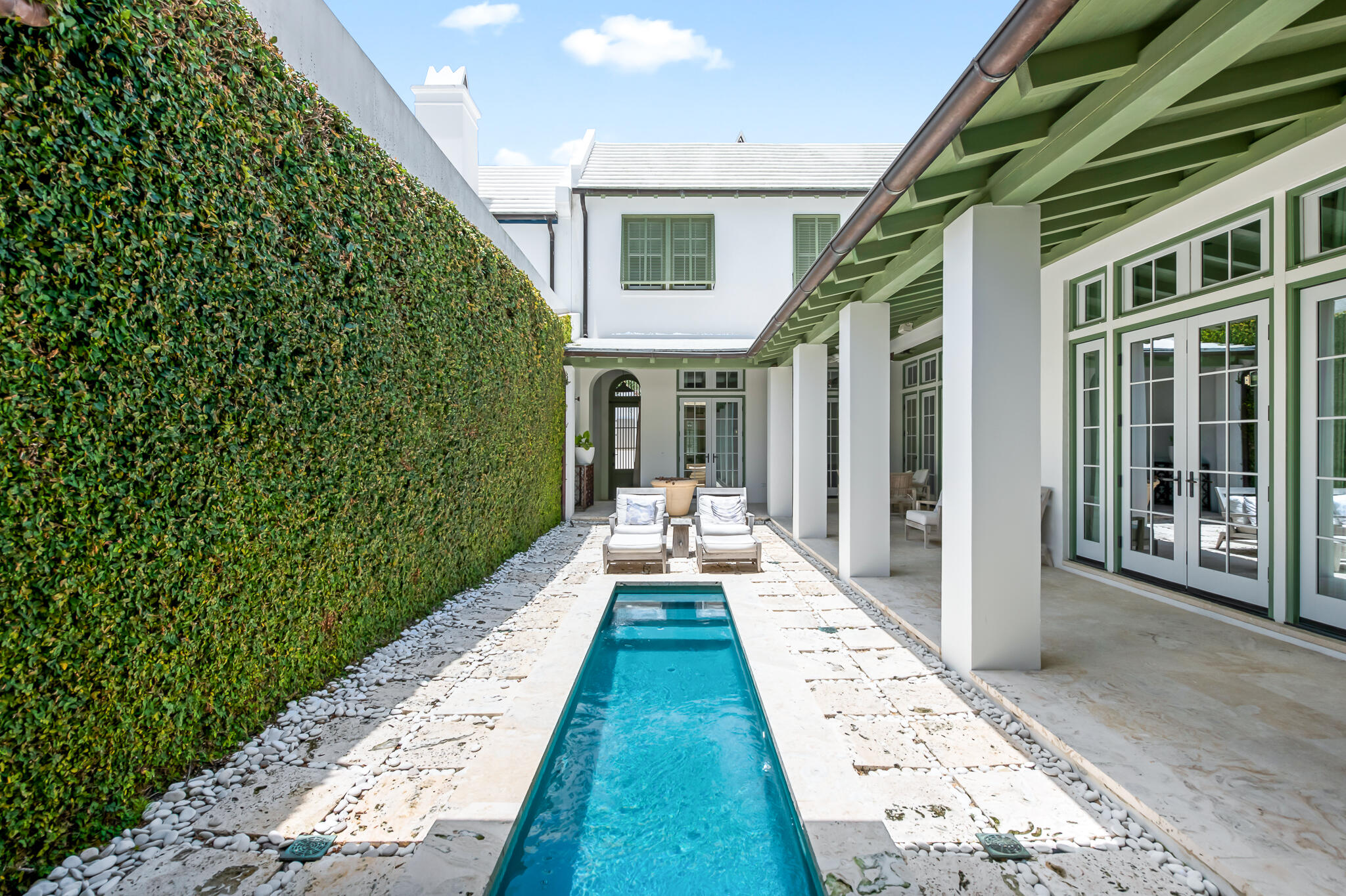 Quintessential Alys Beach courtyard home offering 3 BR, 3.5 BA and a second floor flex space is all masterfully designed by architect, Gary Justiss. Prime location fronting North Charles street with close proximity to Caliza Pool and Restaurant and Town Center. The serene private courtyard is surrounded by a generous shaded loggia overlooking the dipping pool and courtyard walls covered by lush creeping fig. The open floor plan kitchen, dining and living areas are finished in hand-applied Venetian plaster and flooring is Dominican Shellstone. The kitchen, with a limestone topped island, boasts top of the line appliances: Subzero refrigerator, Wolf 6-burner range with pot filler. Custom wormy oak cabinets and doors are found throughout the home matching the stained oak flooring on second level. Opening to the courtyard, the living room with fireplace, graceful arches and French doors creates a welcoming gathering space.

The first floor Master suite frames the courtyard and overlooks the pool. The Master bath offers a relaxing haven with an arched grotto inspired soaking tub, skylight, Mexican Beach Pebble tiled shower floor and double vessel sink vanity.

Two spacious bedrooms, each with private baths, children's flex space and rooftop terrace perfect for starry evenings complete the second floor. Built to "Fortified...For safer living" standards. Home is being sold furnished and has rental linens and kitchen package already in place. Two assigned spaces in parking court.

