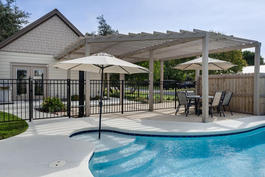 This updated, like new custom one story home has been completely renovated in 2014 with a new roof. Updates include all new stainless steel appliances, granite counter tops, flooring, paint, lighting & fixtures, hardware and heated pool. The oversized master BR has a built in bookcase, refreshment center and sitting area. The Master Bath boasts double glass vessel sinks, jacuzzi jetted tub w/ large custom tile shower. Two bedrooms share a jack-n-jill bathroom and have abundant closet space. This custom home has an outdoor shower, 2 private porches, tankless gas hot water heater, sprinkler system, beautiful landscaped yard, large pool area w/additional side patio for grilling. One block from the beach and is rental ready. Great investment home. 2016 Rental Projection is 55K.