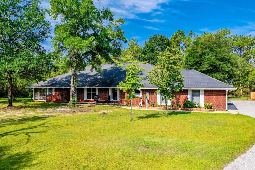 Room to Roam on your 32+ Acres less than 10 minutes to town! 40x35 Workshop w/THREE roll up doors and 10x35 Overhang, trails throughout woods, pistol range, chicken coop, storage shed, smokehouse, 33x16 pole barn, and a 2,400+SF home w/video surveillance! Small scale agriculture allowed! Updated home features NEW waterproof vinyl plank flooring, GRANITE counters, FRESH paint, with a split bedroom design. 52x11 Florida Room and 48x9 Screened porch! 2nd Full Bath has access to back porch. Enjoy your outdoor lifestyle from every room w/natural lighting and a beautiful wooded view from the Kitchen. MANCAVE? You got it! Left side of attached garage converted to heated and cooled room w/closet (4th Bedroom) and there's still room to park your vehicle! Schedule your private viewing today!