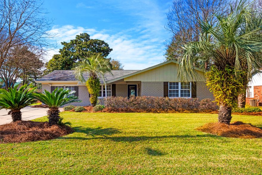 Fabulous opportunity to invest in Destin real estate at a COMPELLING PRICE POINT! This immaculate 3 BR/2 BA all-brick single level home features 1620 SF, and is sparkling clean, a zen-like eclectic space, and thoughtfully laid out. You will feel instantly at ease as you step inside! Features a HUGE Eat-in Kitchen overlooking the beautiful back yard, with custom tall kitchen maple cabinetry, newer stainless steel appliances, beautiful granite, AND two Living Areas, one with an open wood-burning fireplace, and another intimate DEN space that is perfect for relaxing!! There are beautiful hardwood floors and tile throughout the entire home, no popcorn ceilings, updated paint and trim, crown molding details. Two full updated Bathrooms, one with tiled bath and shower, and Master Bath with shower