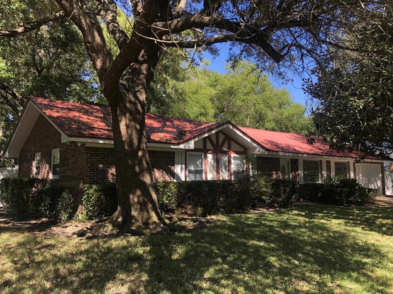 Price Improvement!! This wonderful all BRICK siding, 3 bedroom, 2 bath SINGLE story home located in the heart of Destin is available for IMMEDIATE occupancy and is MOVE IN ready, just bring your Refrigerator. Offering a Large OPEN concept kitchen/dining/great room area, great for entertaining. GRANITE countertops and STAINLESS STEEL appliances, !!NO HOA, NO ASSOCIATION FEES!! Large lot with beautiful oak trees, FENCED back yard, multiple varieties of mature fruit producing CITRUS trees. Nice size out building, great for WORK SHOP, storage, etc.Plenty of space to park your BOAT, less than 1 mile from Joe's Bayou boat ramp. With quick access to the Choctawhatchee Bay and Gulf of Mexico. Approximately 1 mile from Harborwalk Village. The Wind Mit puts the STRONG METAL roof replaced in 2012.