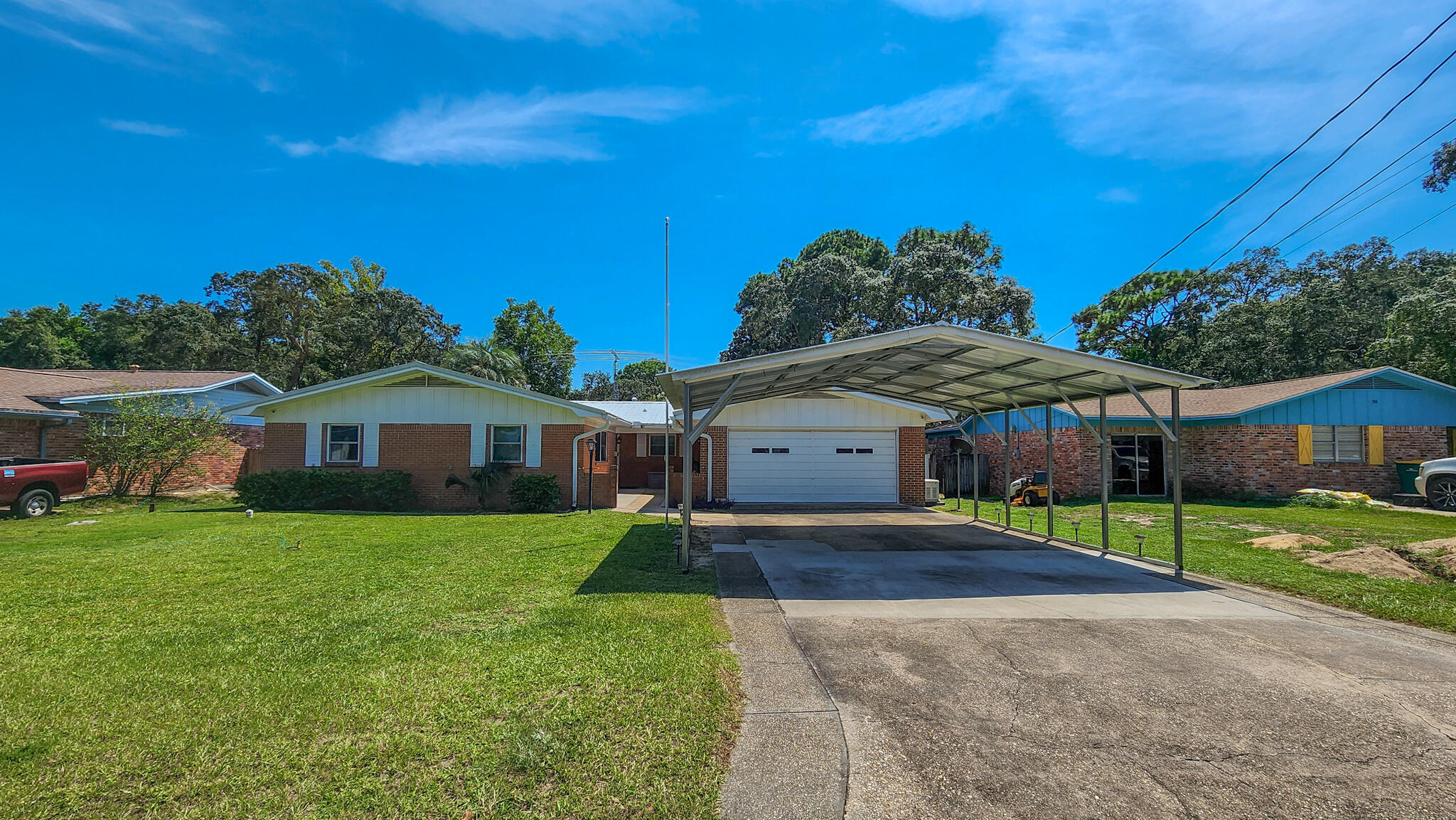 Welcome to 712 Revere Avenue, a Solid, Brick Home in a Great Neighborhood!Pride of ownership shines in this well-maintained three-bedroom, two-bathroom home offered by its second owner. Located in a quiet, established Fort Walton Beach neighborhood, this spacious brick residence features a two-car garage, an additional carport, and a generous layout that provides both comfort and functionality. Inside, you'll find elegant Italian tile floors, crown molding throughout, and fresh interior paint. The flexible floor plan includes a formal living room, a cozy family room, a den, and a dedicated dining area, offering ample space for everyday living and entertaining. An oversized laundry room adds convenience with plenty of extra storage. Built to withstand the elements, the home features a durable metal roof and custom hurricane-rated windows with opaque coverings for added protection. It is also equipped with a whole-house Generac generator, providing peace of mind during storm season. A non-monitored exterior security system records to an in-house station for an additional layer of security.
The fully privacy-fenced backyard is perfect for both relaxing and working. It includes a separate dog yard, a screened-in shed with electricity that is ideal for a workshop or studio, a covered patio with a metal gazebo, and a storage shed for tools or lawn equipment. The piano is optional at no extra cost, and the towers and solar equipment in the backyard will be removed before closing. This move-in ready home offers quality, space, and peace of mind. Schedule your showing today!