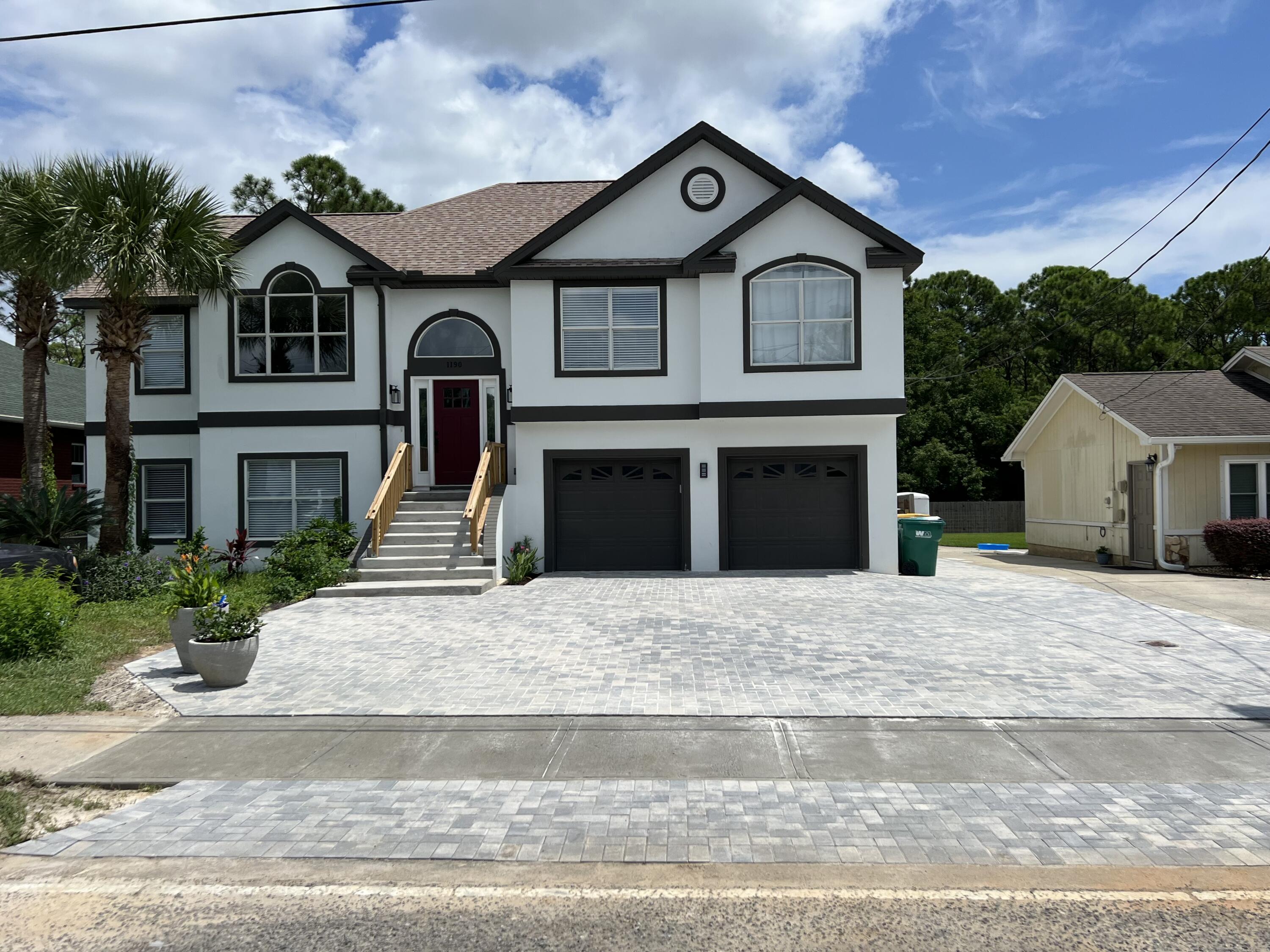 Dream coastal retreat in Old Destin. This beautifully remodeled 5-bedroom, 3.5-bathroom home combines modern luxury with serene beach living. Located just minutes from the water backing up to Mattie Kelly nature preserve, spacious living areas inside + out, top of-the-line finishes make it the perfect sanctuary for relaxation and entertaining.3 Bedrooms on the main level with large loft area overlooking the living area, 2 bedrooms on the lower level. 3.5 Bathrooms: Fully updated with sleek fixtures, including a master bath, soaking tub, walk-in shower, and dual vanities. Laundry and full kitchen on upper and lower levels. The open floor plan connects the living, dining, and kitchen areas, offering the perfect space for gatherings and family. Bottom floor has locked separate entrance Full Kitchen upstairs and additional full kitchen downstairs. Separate HVAC systems, lower level ideal for rental or mother in law suite/wheelchair accessible. Laundry on both levels. Gas Stovetop and Gas Laundry. Master Closet has built in storage/organization (not pictured).