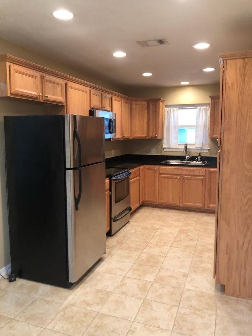Welcome to an adorable, updated home in East Navarre. Terrific location for a quicker commute to Hurlburt Field Base.The home features stainless steel appliances, washer dryer to convey, and granite counter top tiles. Newer windows and lots of natural light throughout the home. The master is oversized and the bathroom has a walk in closet and jetted soaker tub/shower combo. The other bedrooms have large half moon windows and bench seating underneath. It's super adorable and affordable for a great starter home. Full deck out back and lots of privacy with irrigation in the front and back.